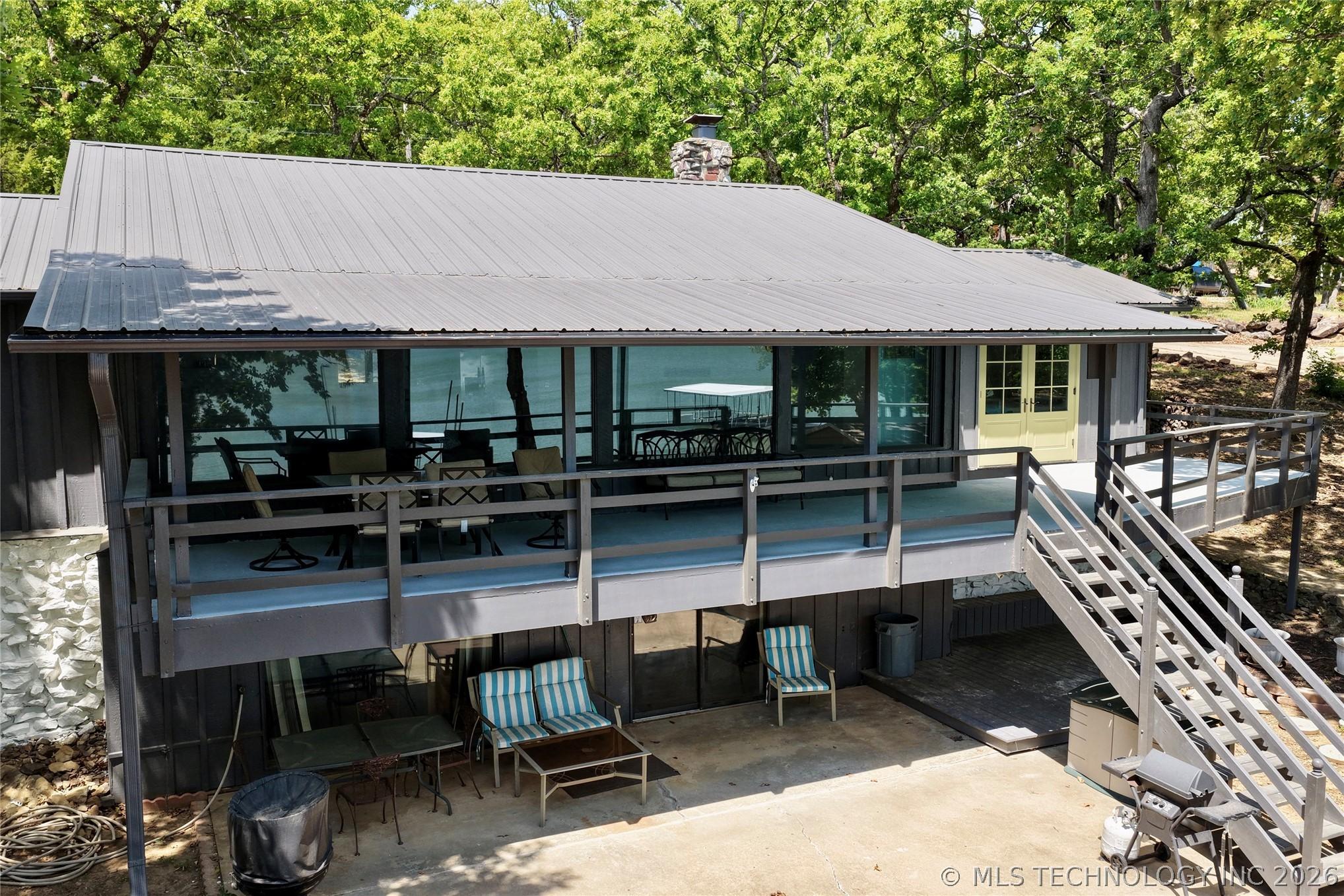 Image 3: Multi-level exterior featuring a metal roof, expan
