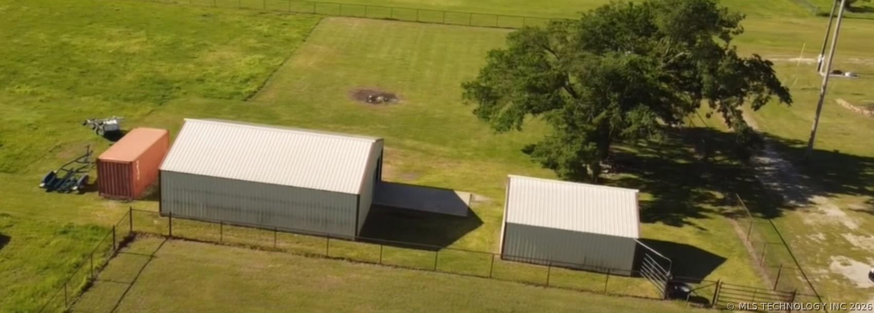 Image 3: Rear fenced area featuring 30 x 40 shop and 12 x 2