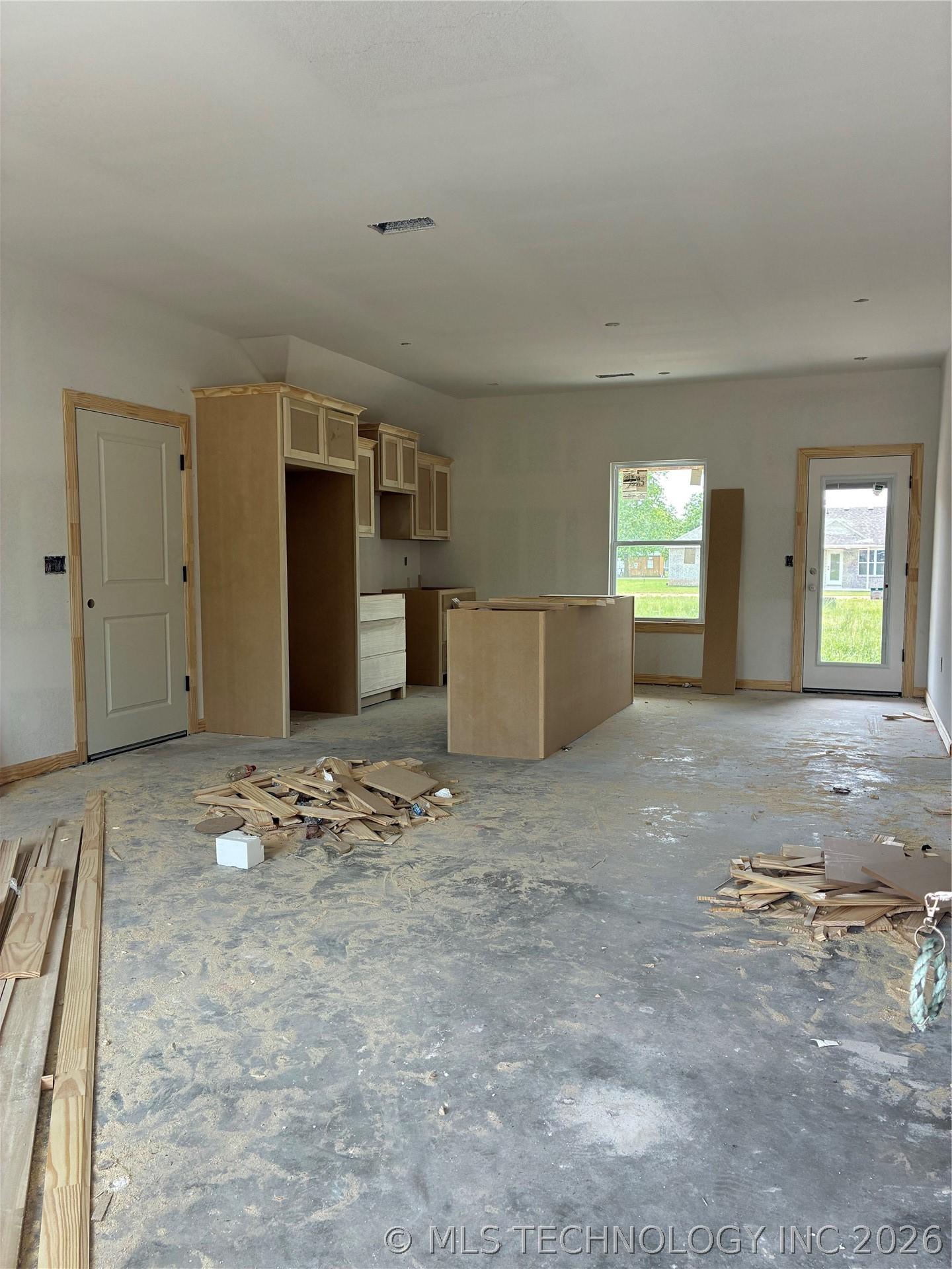 Image 3: Open concept living kitchen and dining room.