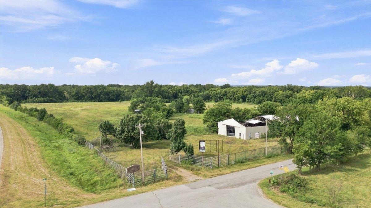 Image 2: Expansive land parcel featuring a perimeter fence,