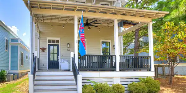 Image 3: Two-story residence featuring a covered front porc