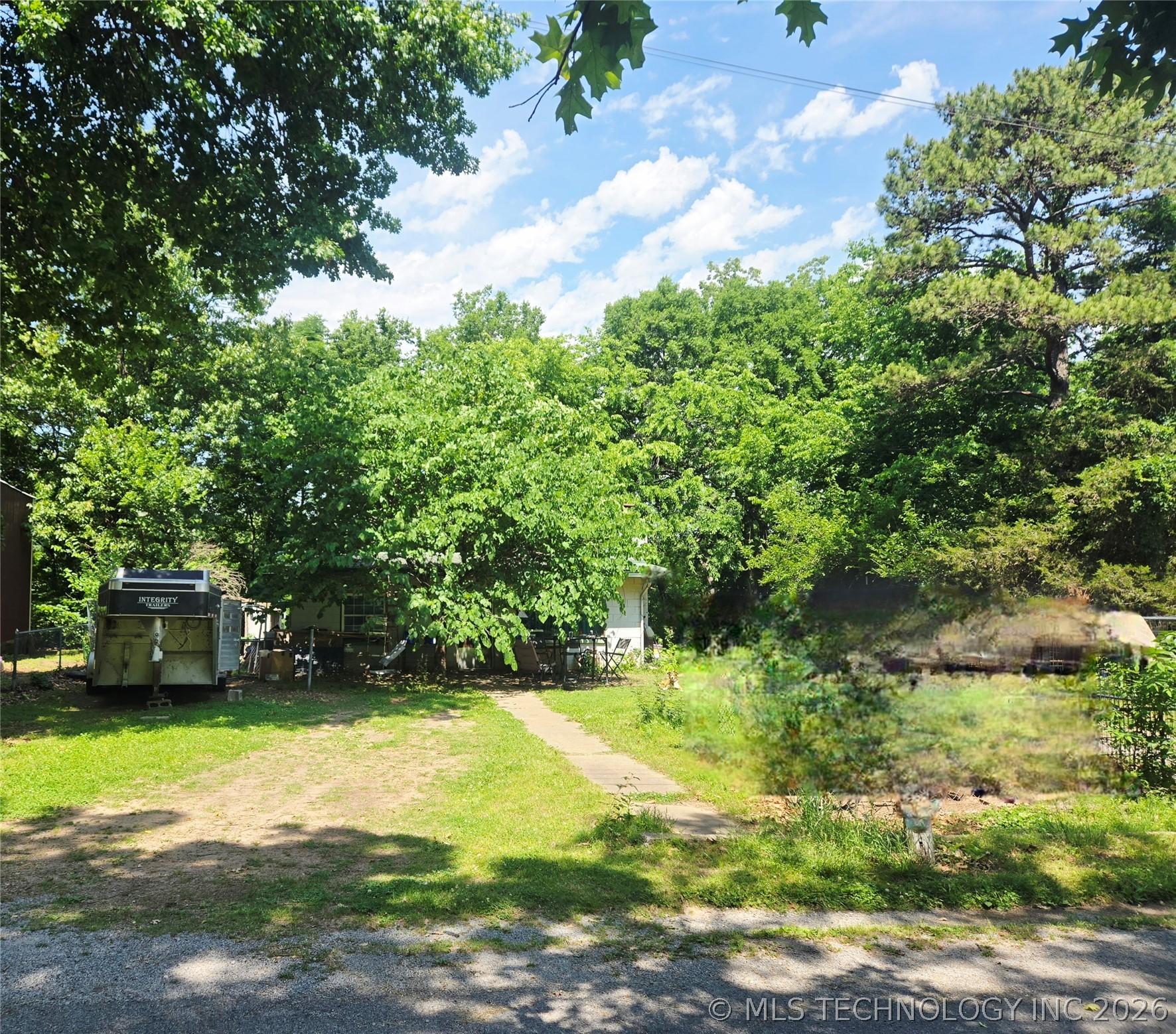 Image 3: Private property set amidst mature trees with a pa