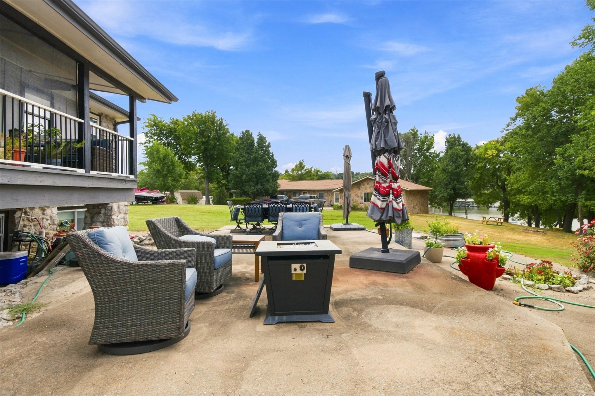 Image 4: Expansive outdoor entertaining space featuring a g
