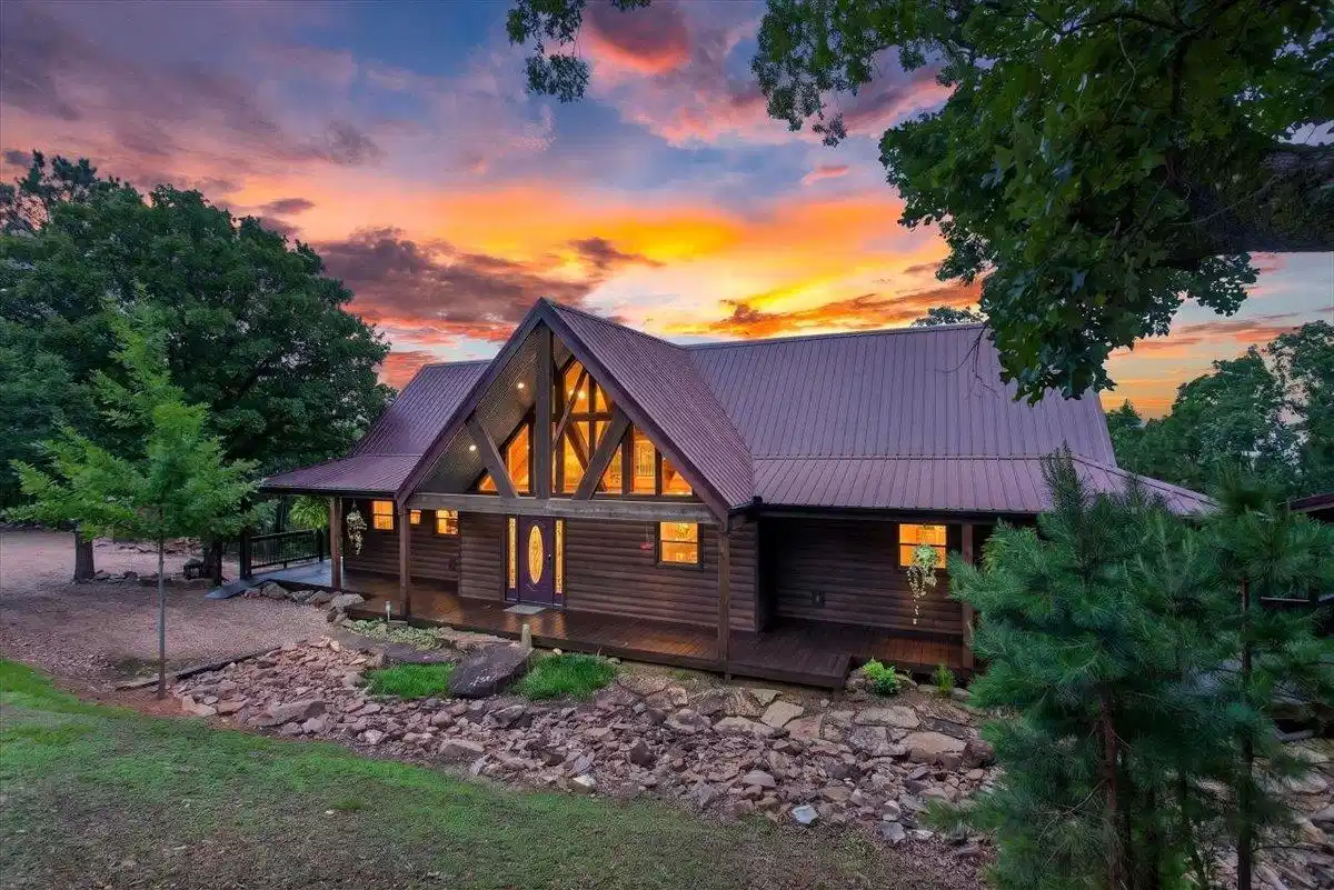 Image 1: Wood-sided exterior featuring an A-frame architect