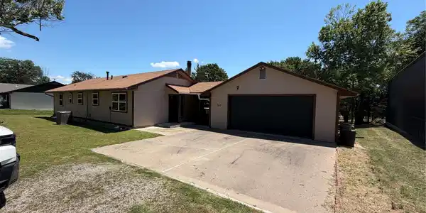 Image 2: THE LARGE GARAGE HAS A COVERED WALK WAY FROM THE H