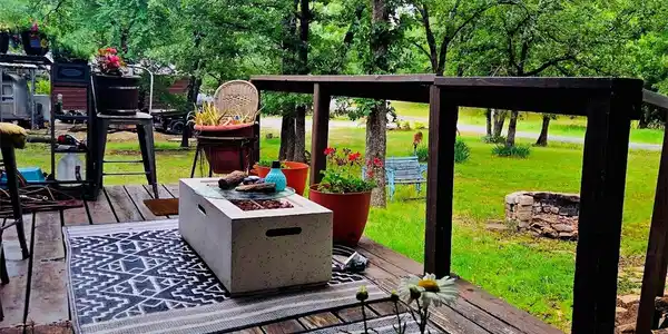 Image 4: Expansive outdoor deck featuring wood-finish floor