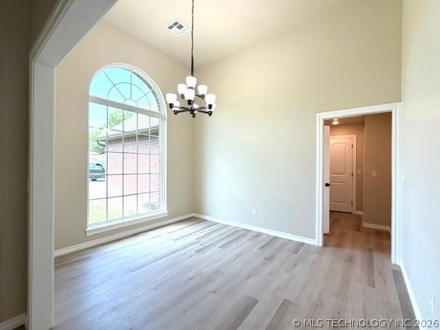Image 4: Spacious dining room featuring vaulted ceilings, a