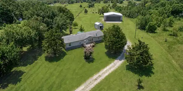 Image 3: Expansive rural property featuring a main residenc