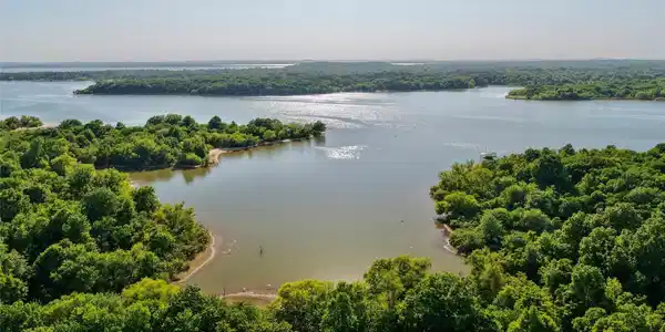 Image 2: Expansive lakefront property featuring a private c
