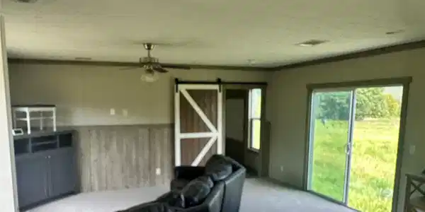 Image 3: Carpet flooring, wood-finish wainscoting, sliding