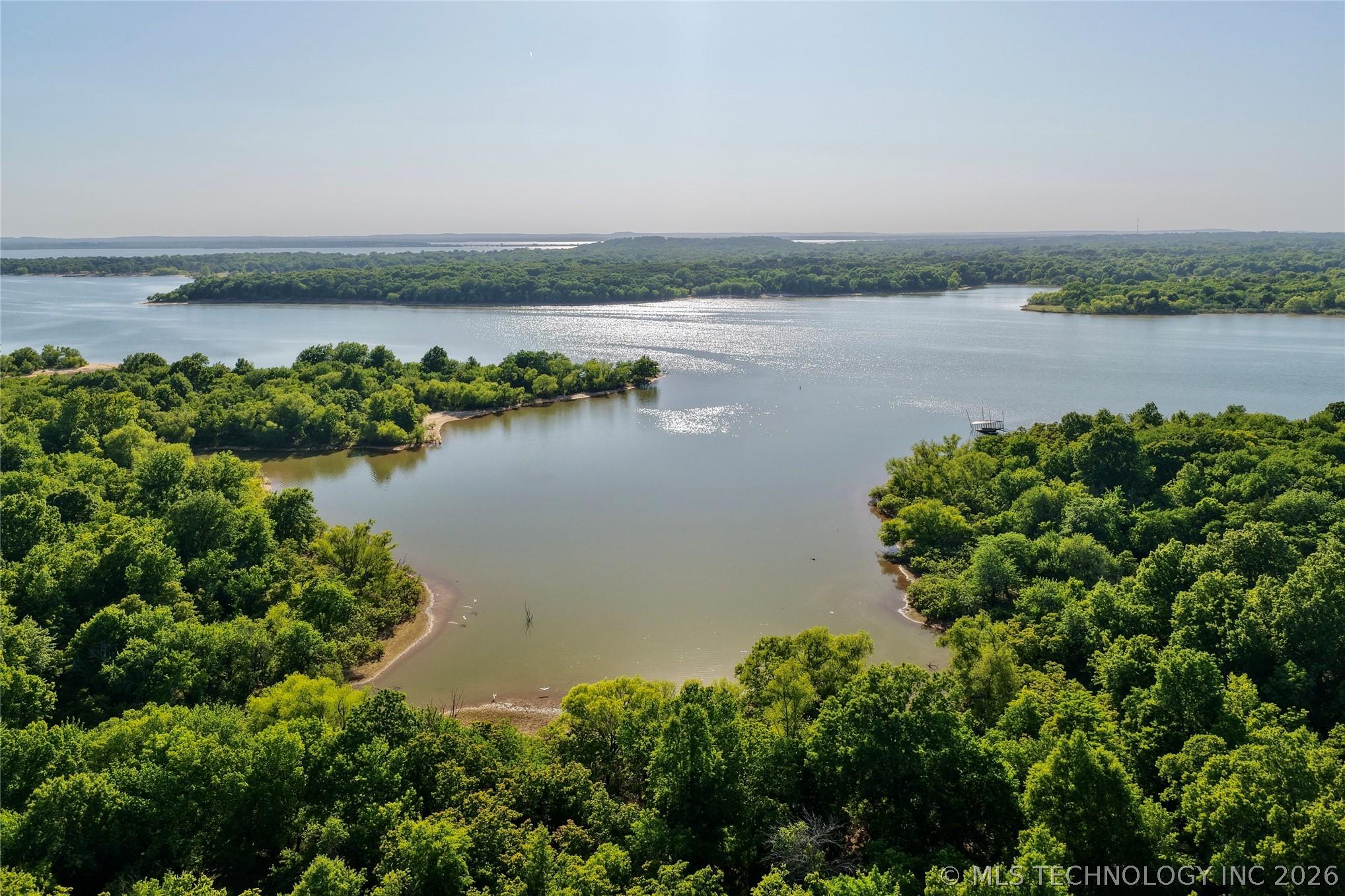 Image 2: Expansive lakefront property featuring a private c