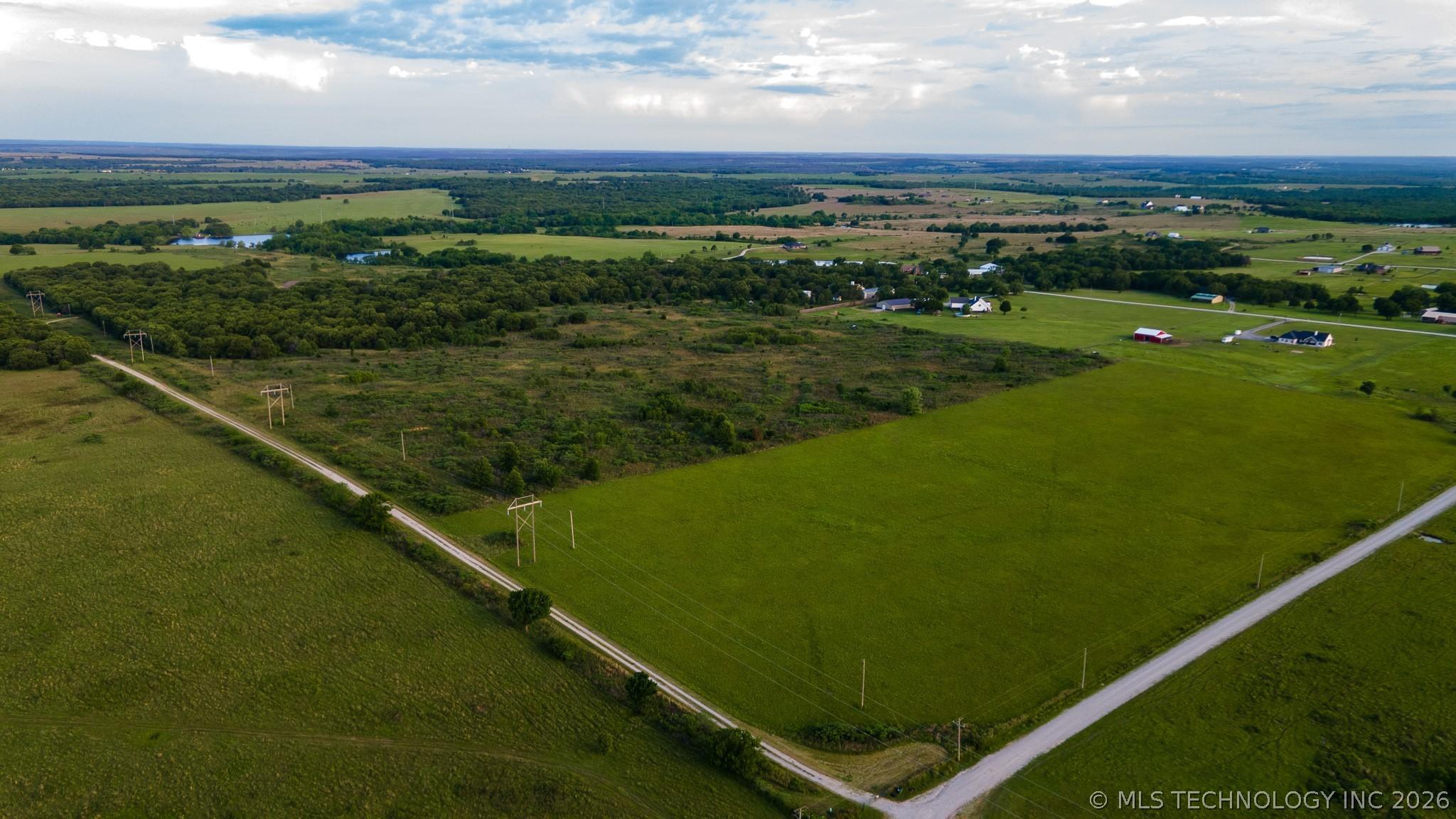 Image 1: Expansive land parcel featuring open fields, woode Image 1: Expansive land parcel featuring open fields, woode
