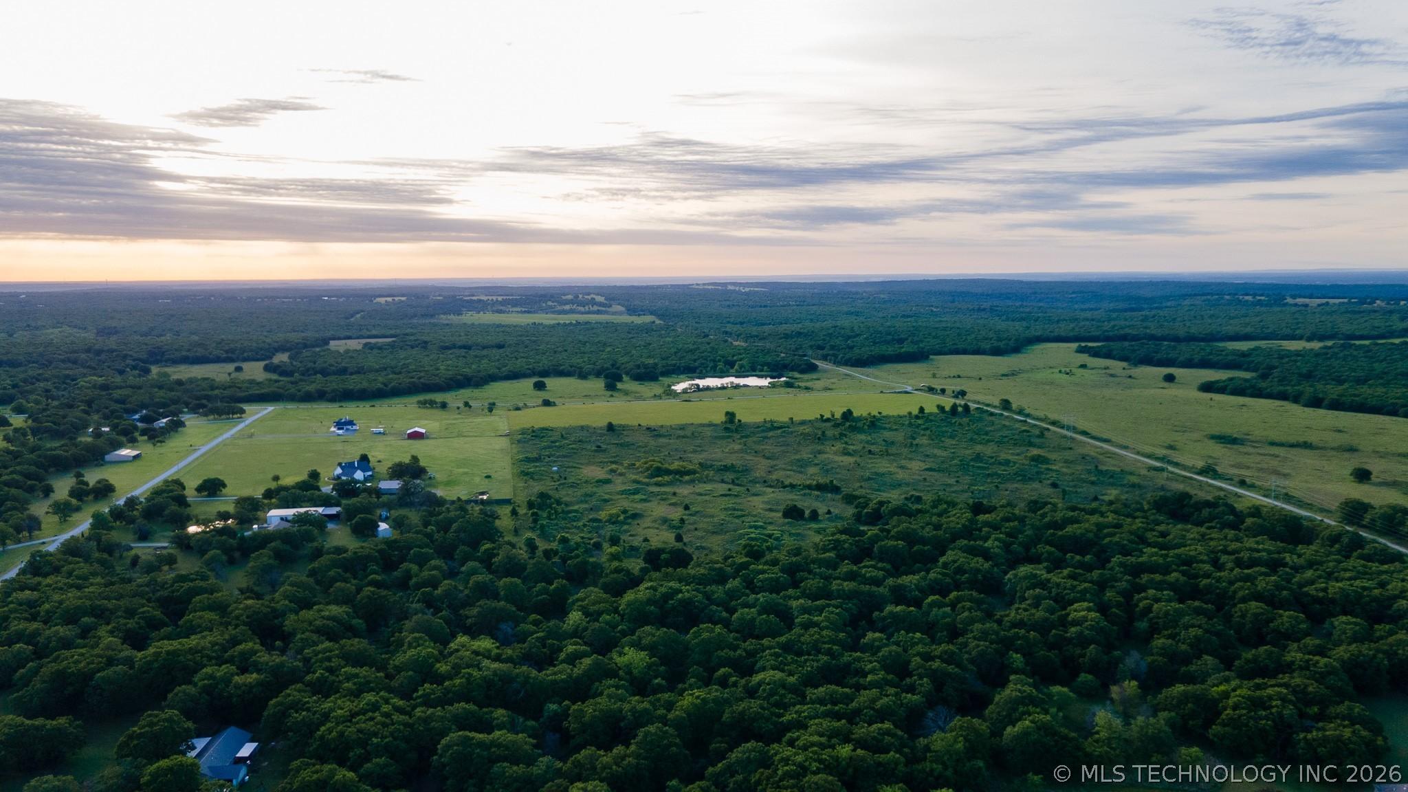 Image 4: Expansive rural landscape featuring a mix of matur Image 4: Expansive rural landscape featuring a mix of matur