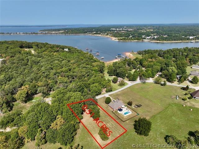 Image 1: aerial view of lot to water