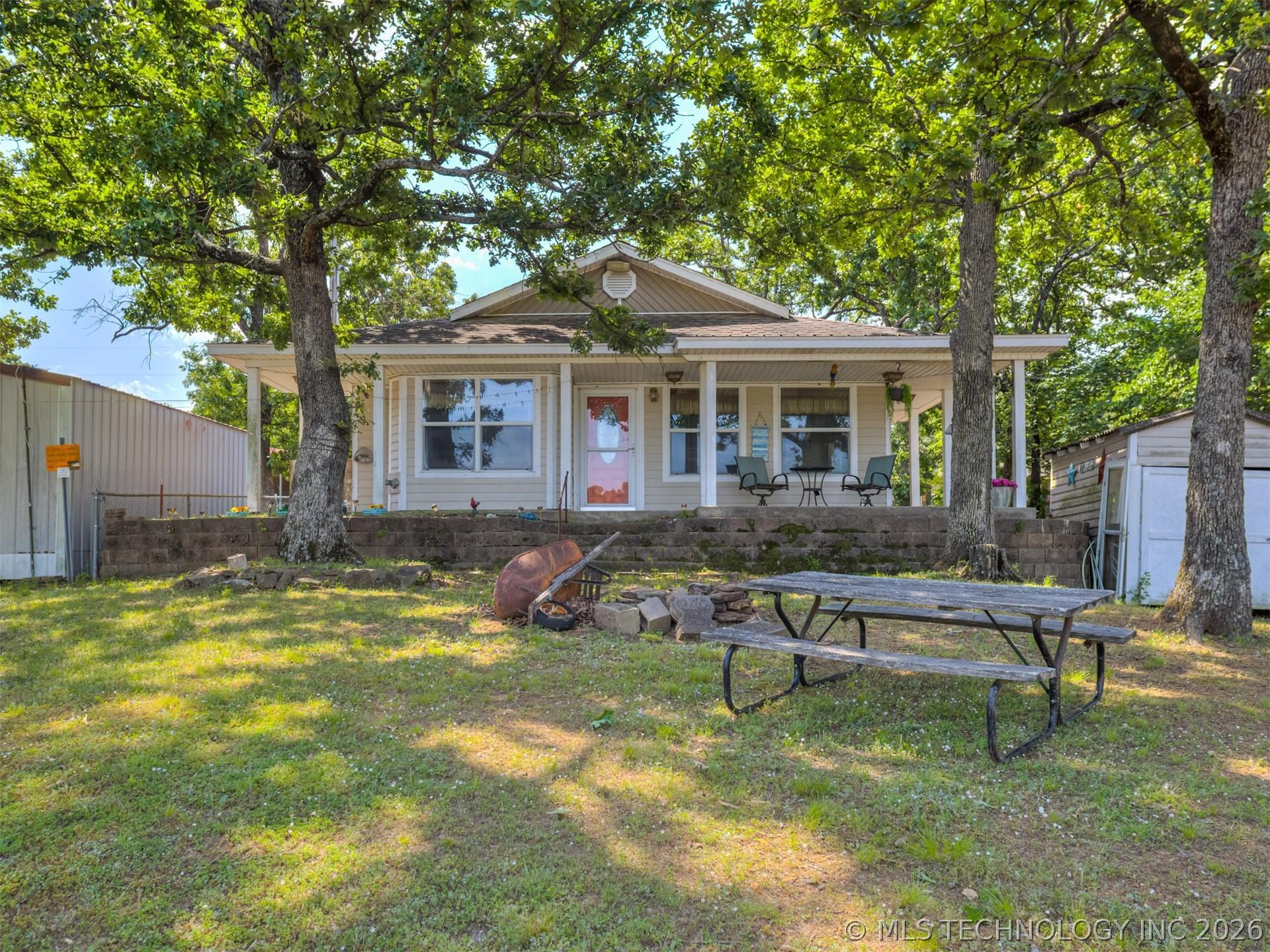 Image 1: Ranch-style residence featuring a covered front po