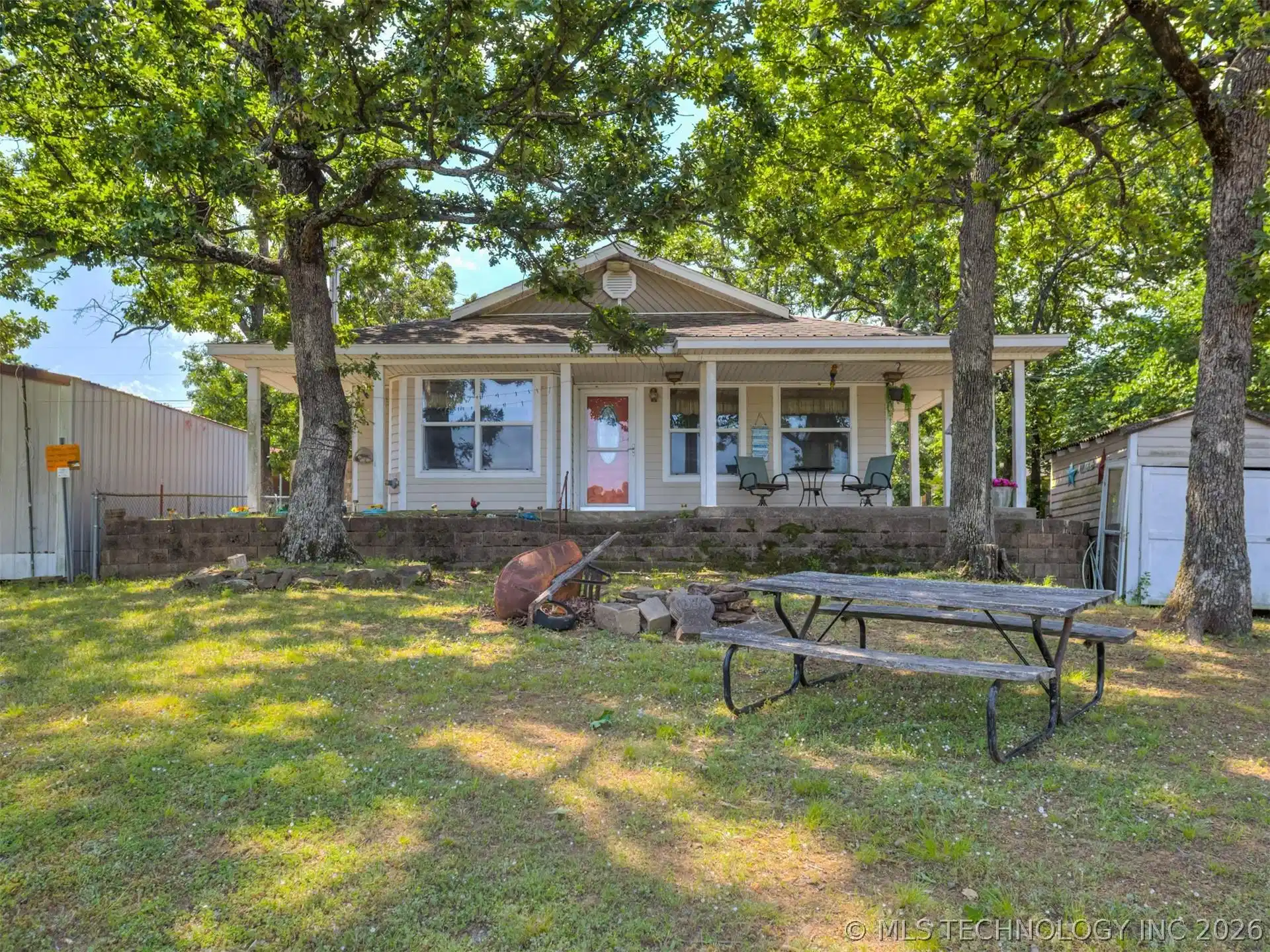 Image 1: Ranch-style residence featuring a covered front po