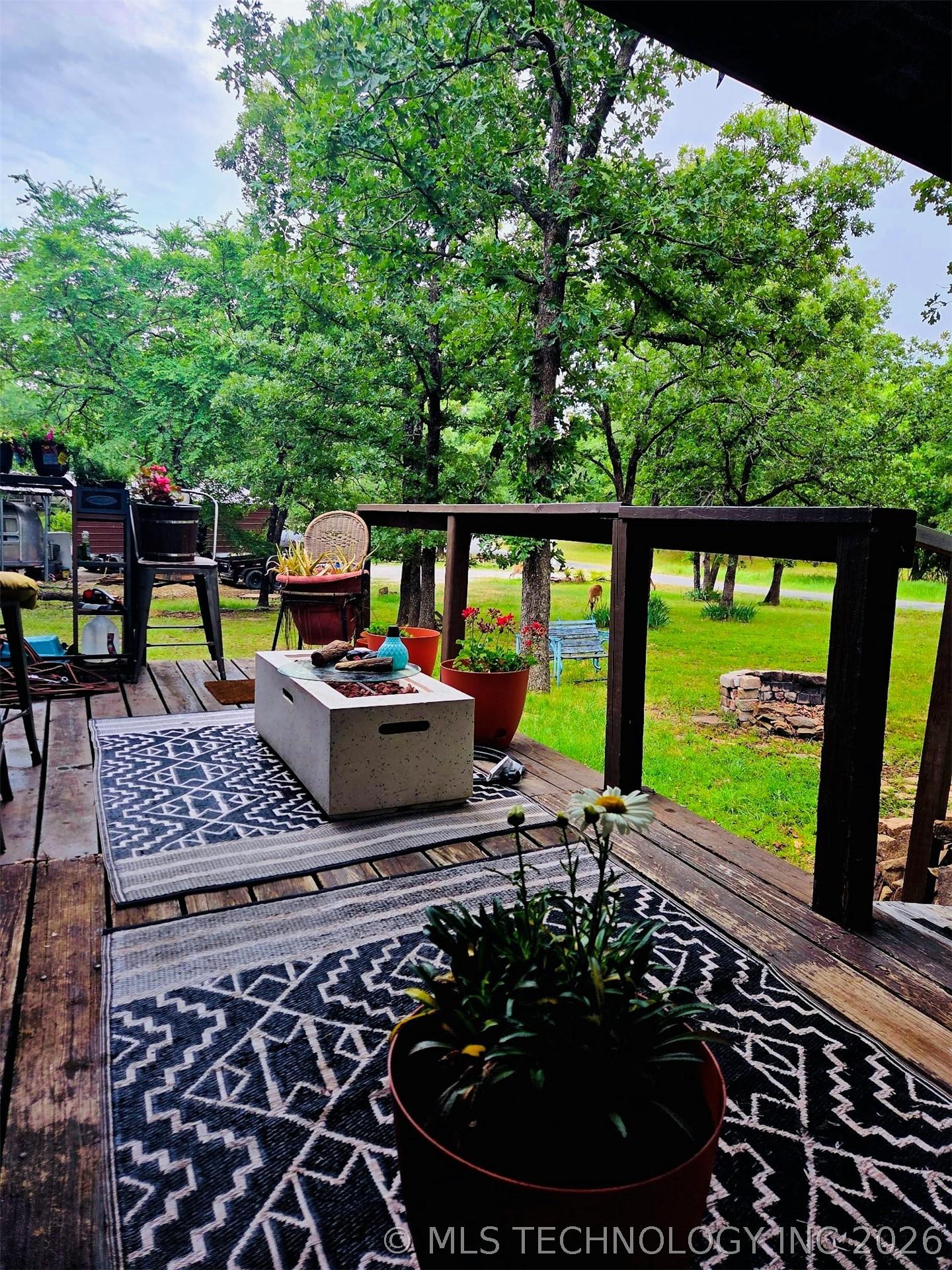 Image 4: Expansive outdoor deck featuring wood-finish floor
