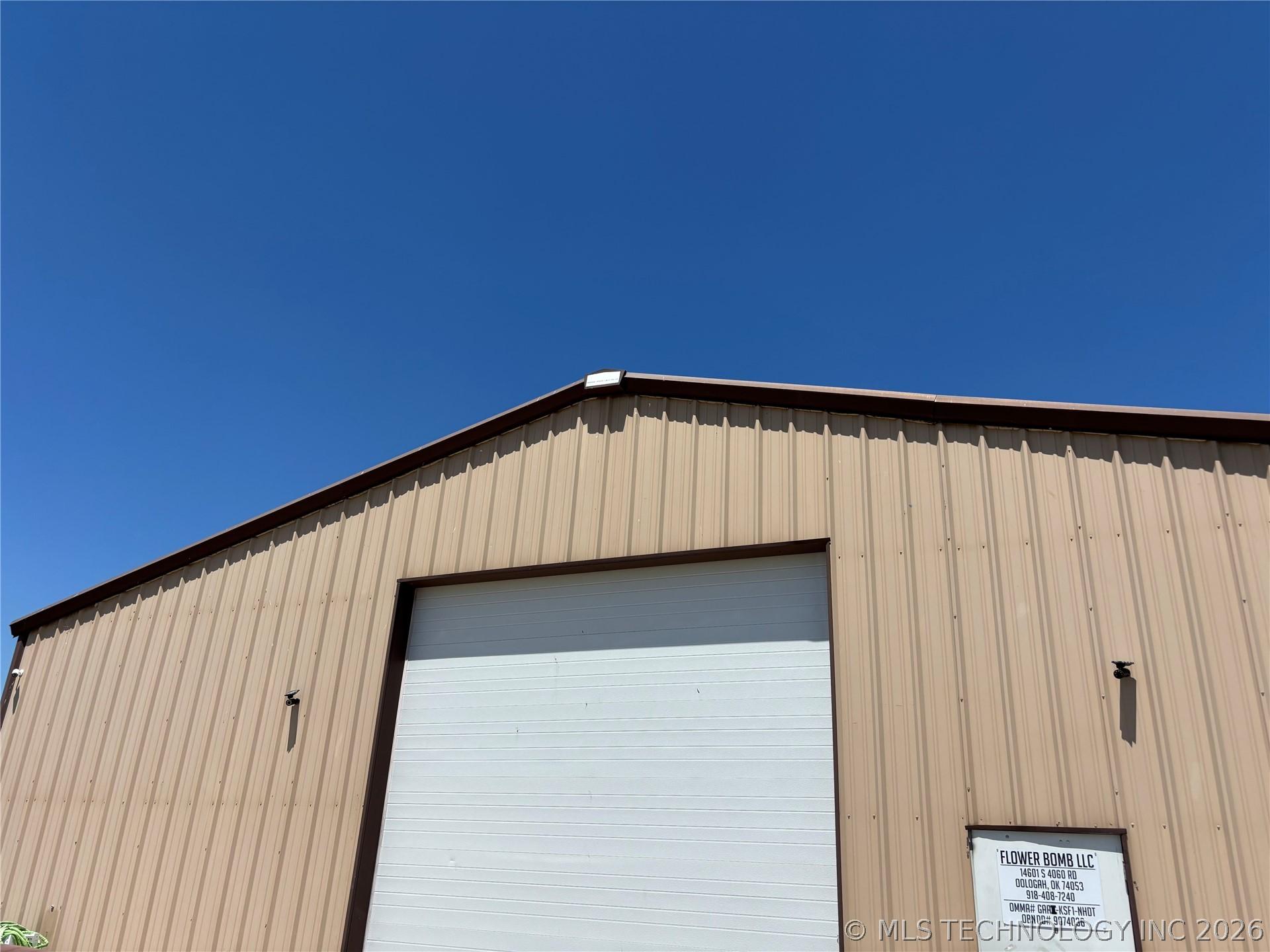 Image 1: Industrial-style building featuring corrugated met
