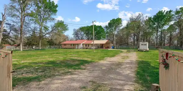 Image 4: Main gate entry and driveway