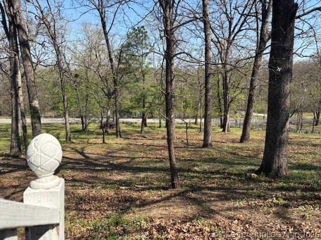 Image 3: View from the front porch overlooking a pond acros