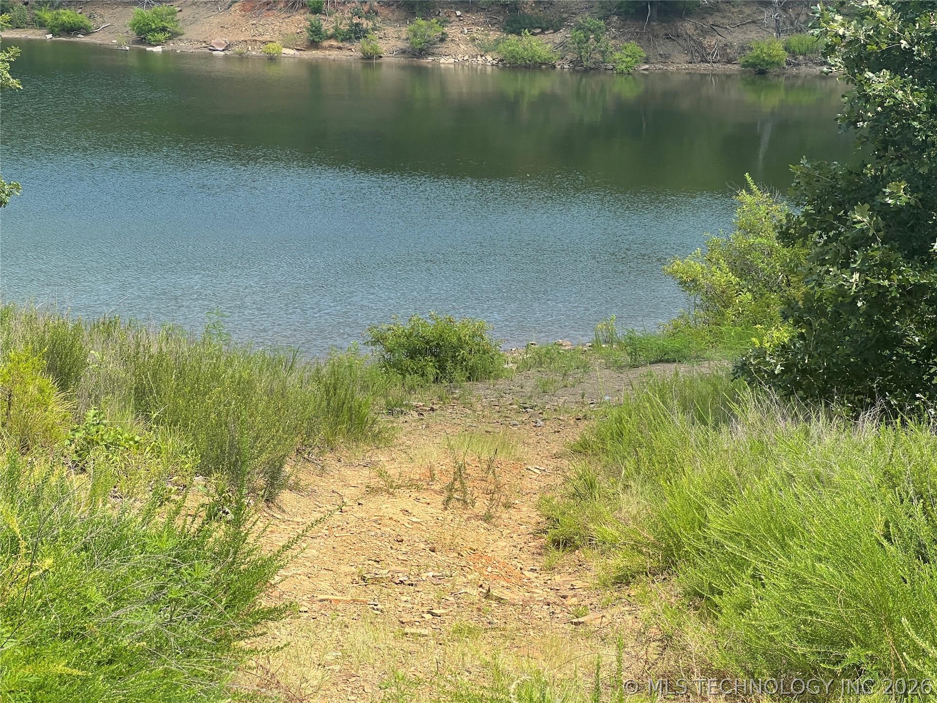 Image 2: Across the road is a trail to the water.