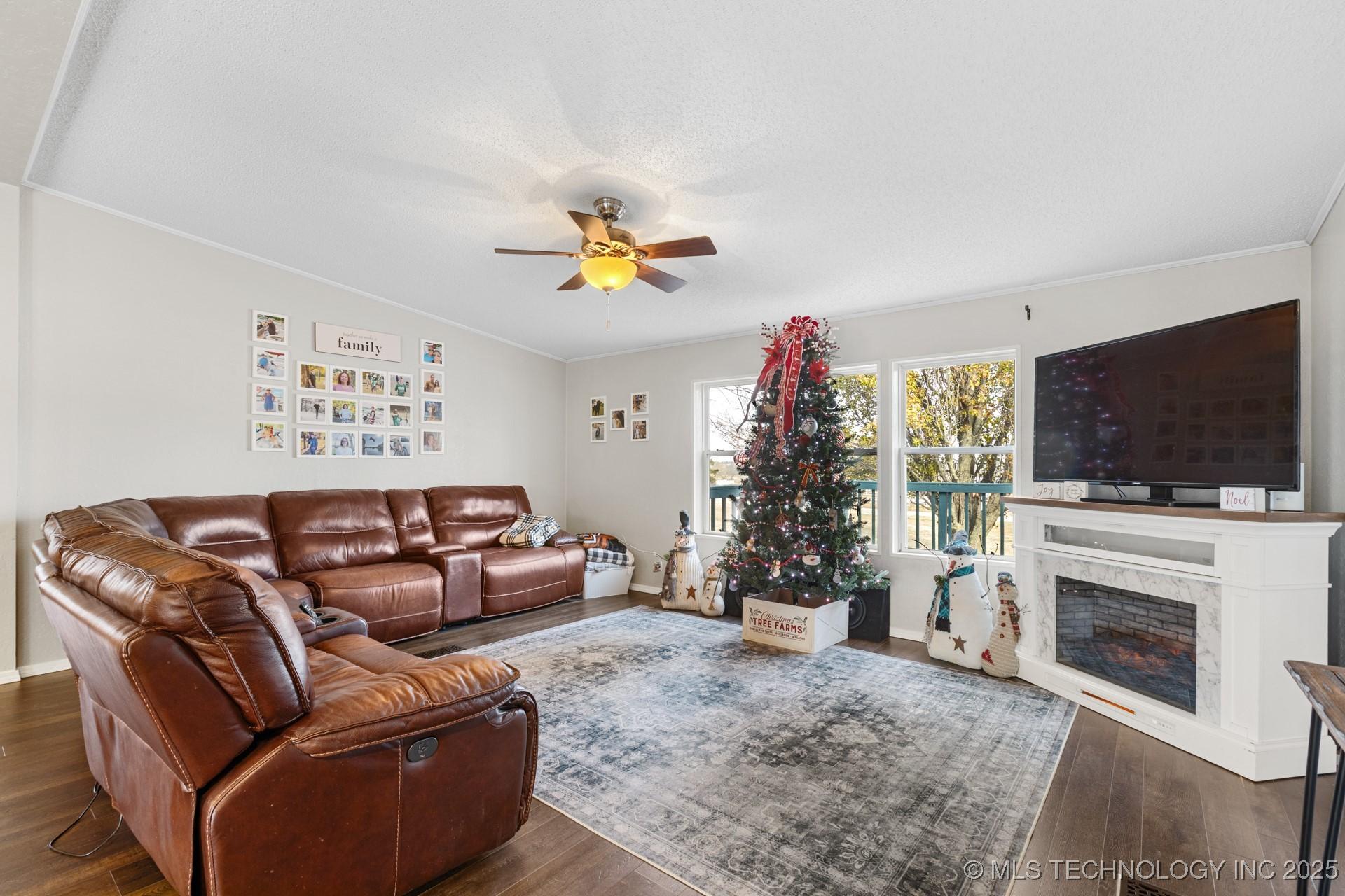 Image 3: One side of living room with electric fireplace