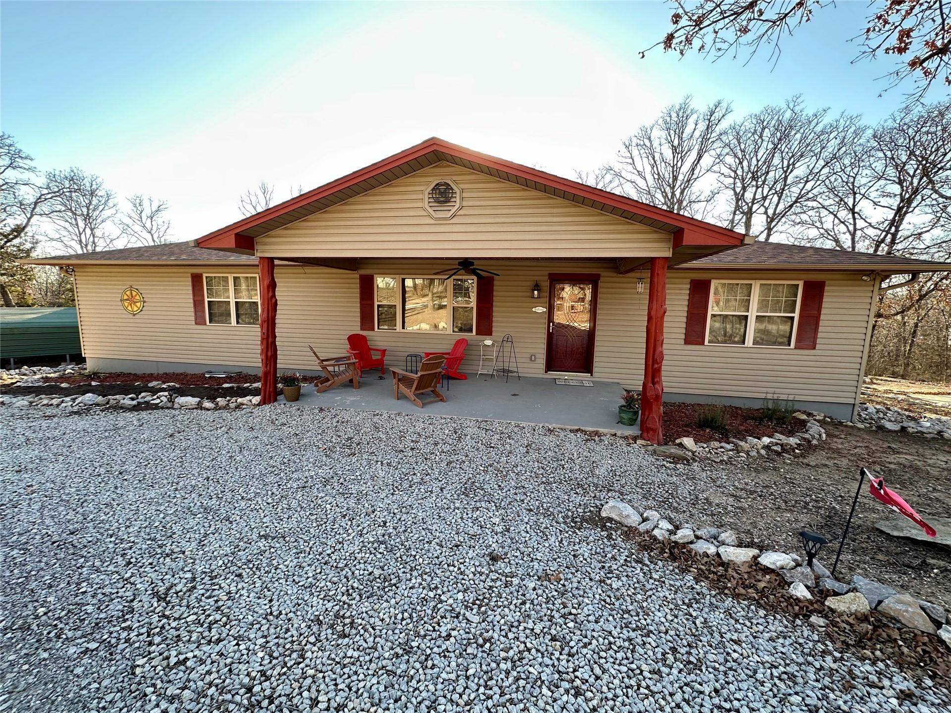 Image 1: Ranch-style residence featuring a covered front po