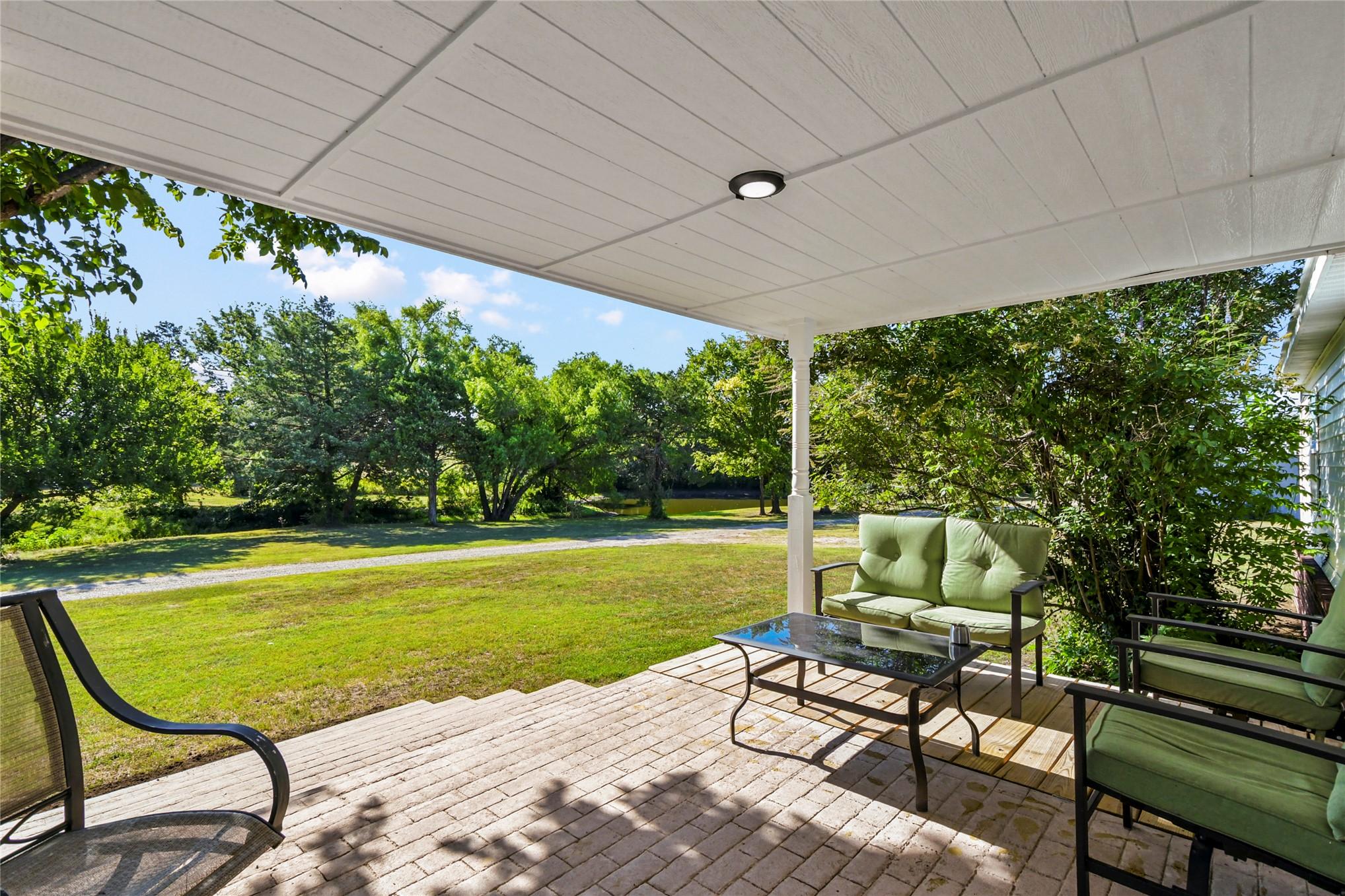 Image 3: Covered patio with a paneled ceiling, recessed lig