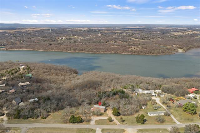 Image 4: Expansive land parcel featuring mature trees, a pr