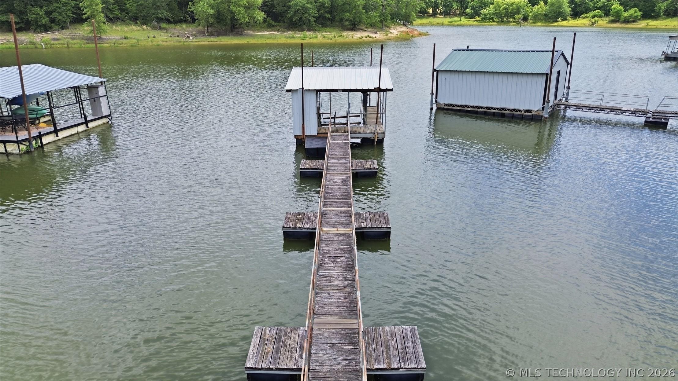 Image 2: Boat dock right behind house in protected cove