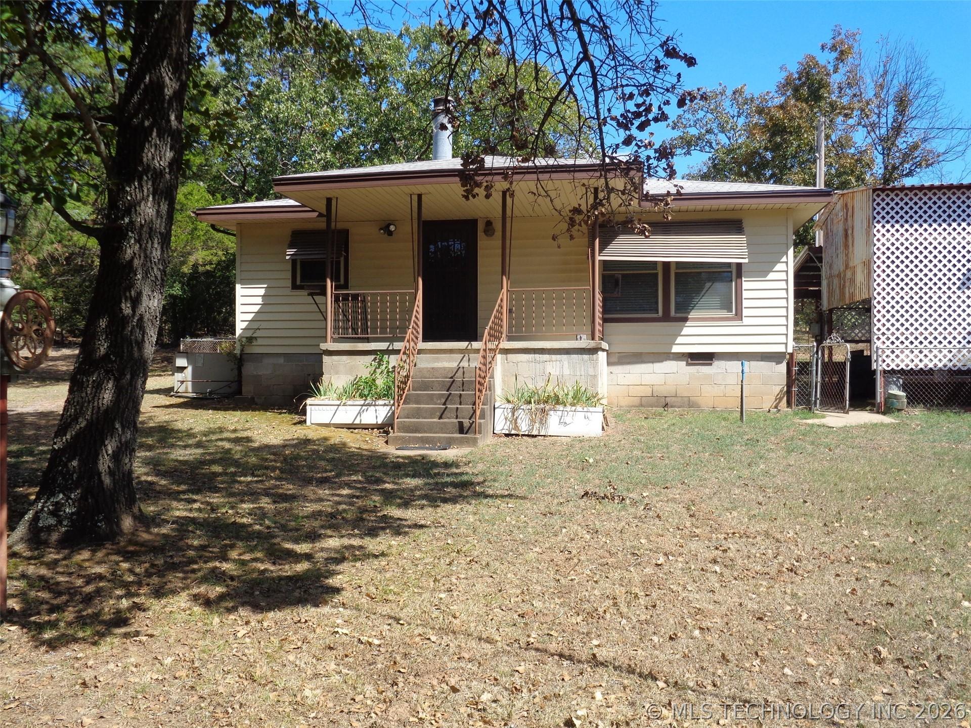 Image 1: Front View of Property; Has almost a park-like set