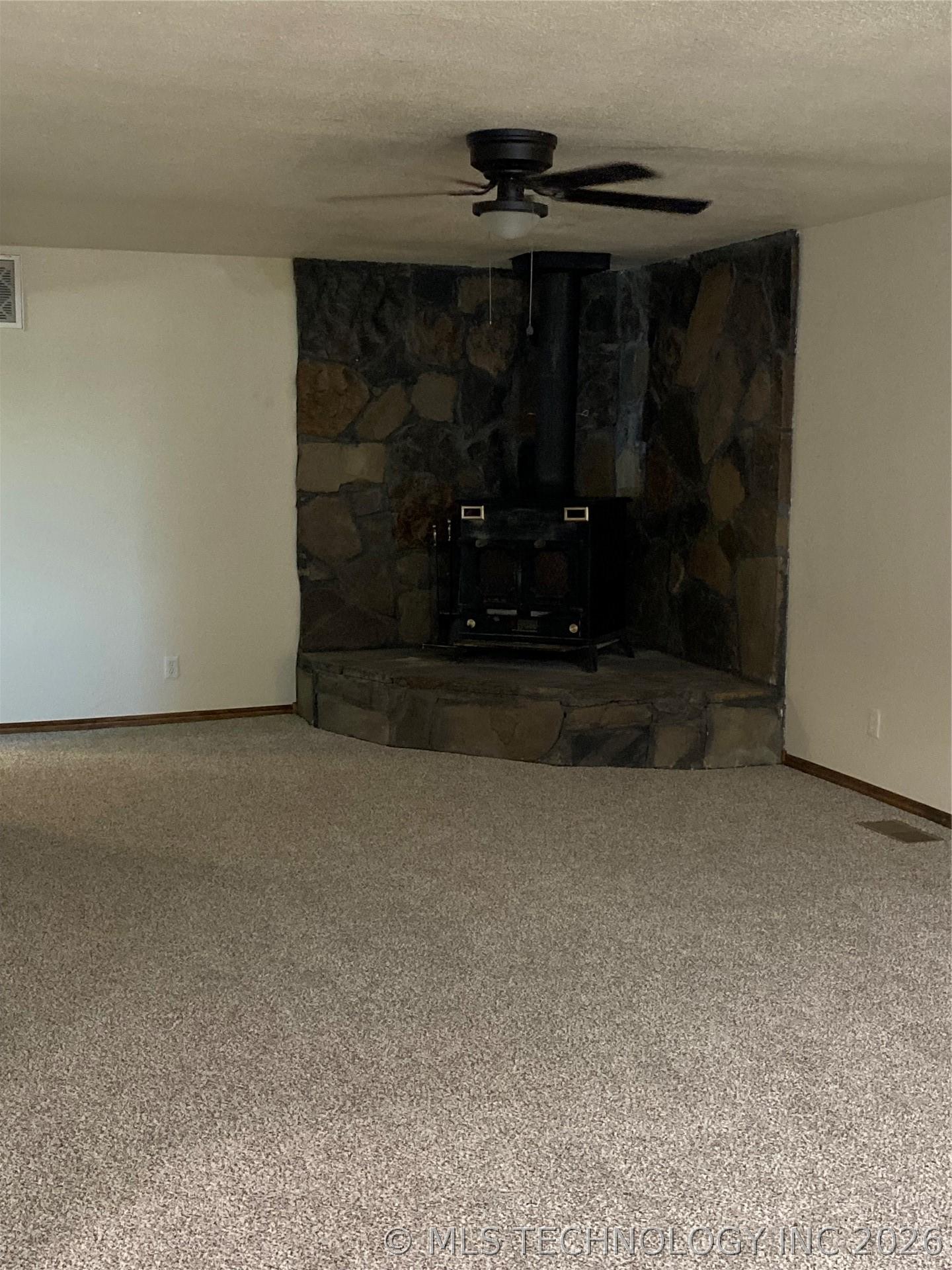 Image 4: Living area with wood stove