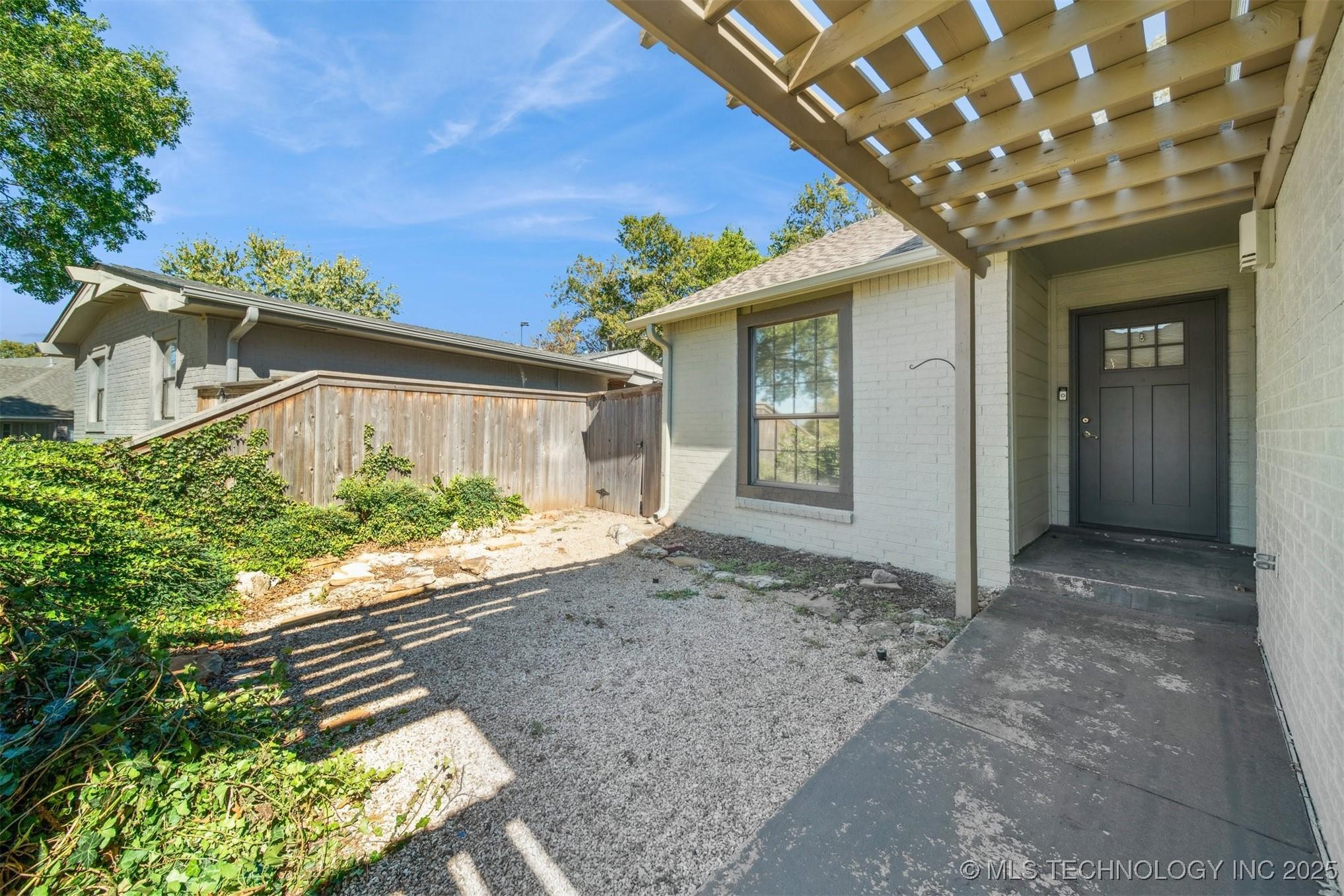Image 4: front door on left courtyard