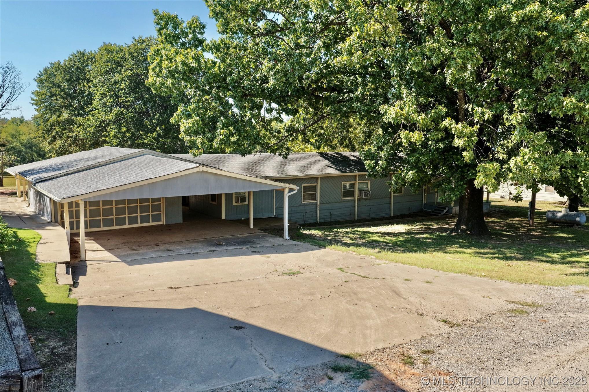 Image 1: Front View of Home; You'll love this large carport