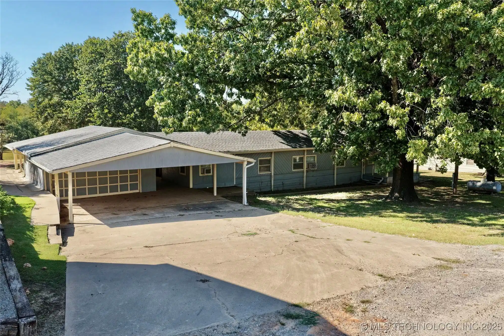 Image 1: Front View of Home; You'll love this large carport