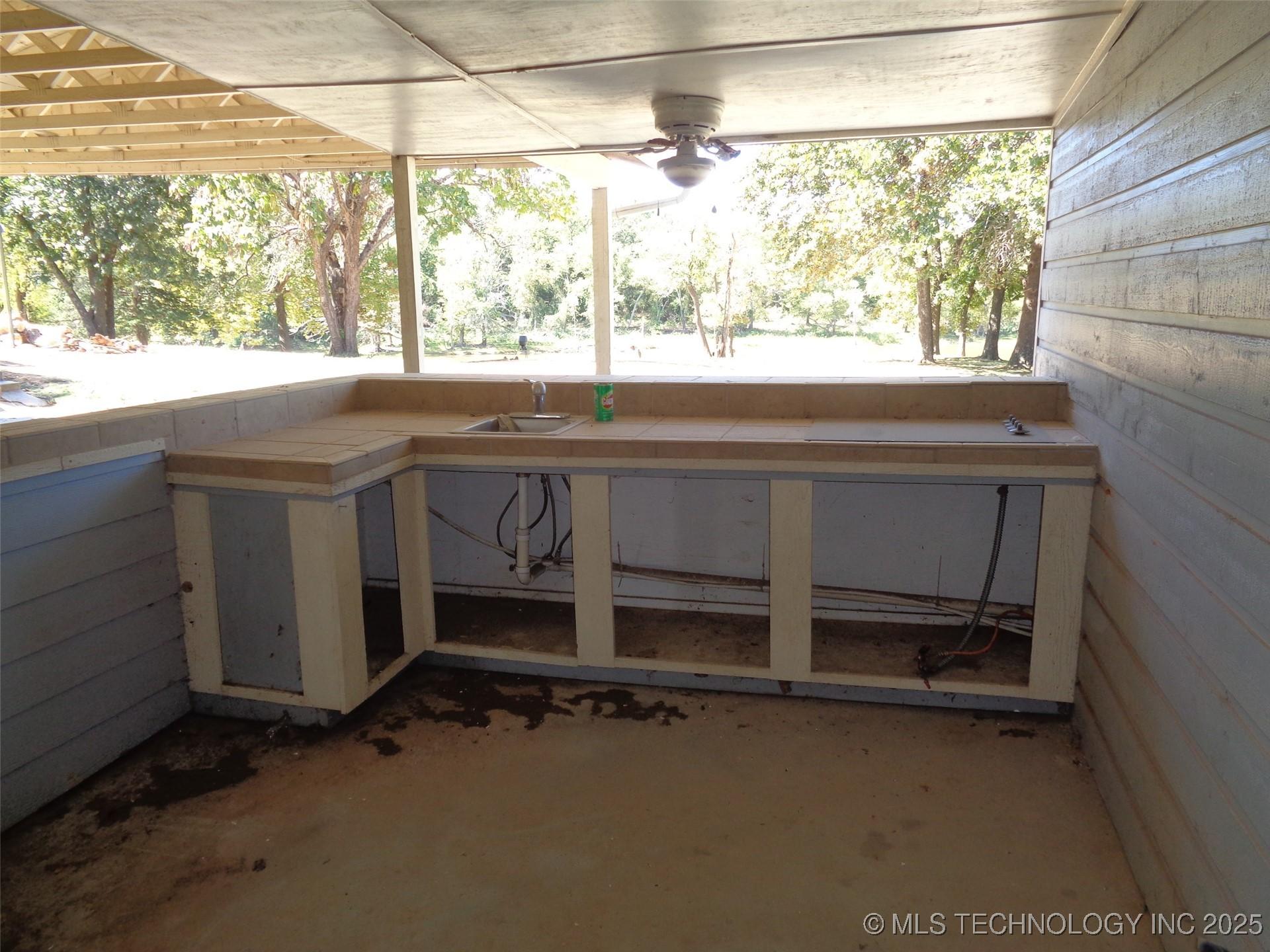 Image 2: Walk through the breezeway and arrive at an outdoo