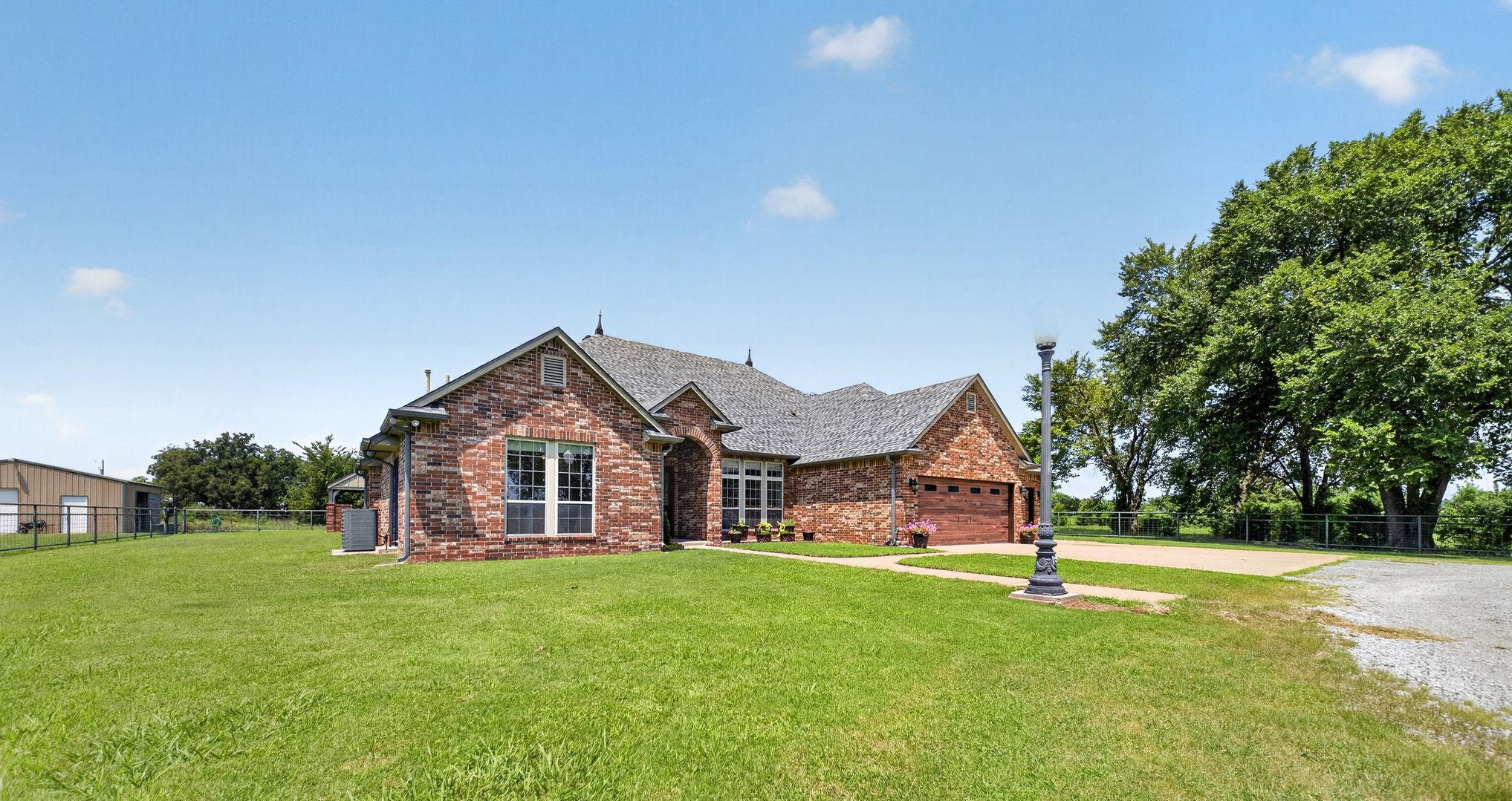Image 3: Brick exterior residence with a shingle roof, inte
