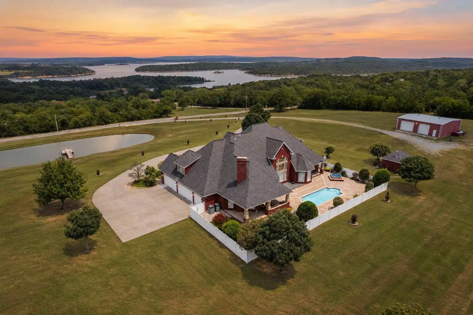 Image 1: Expansive landscaped property featuring a large sw