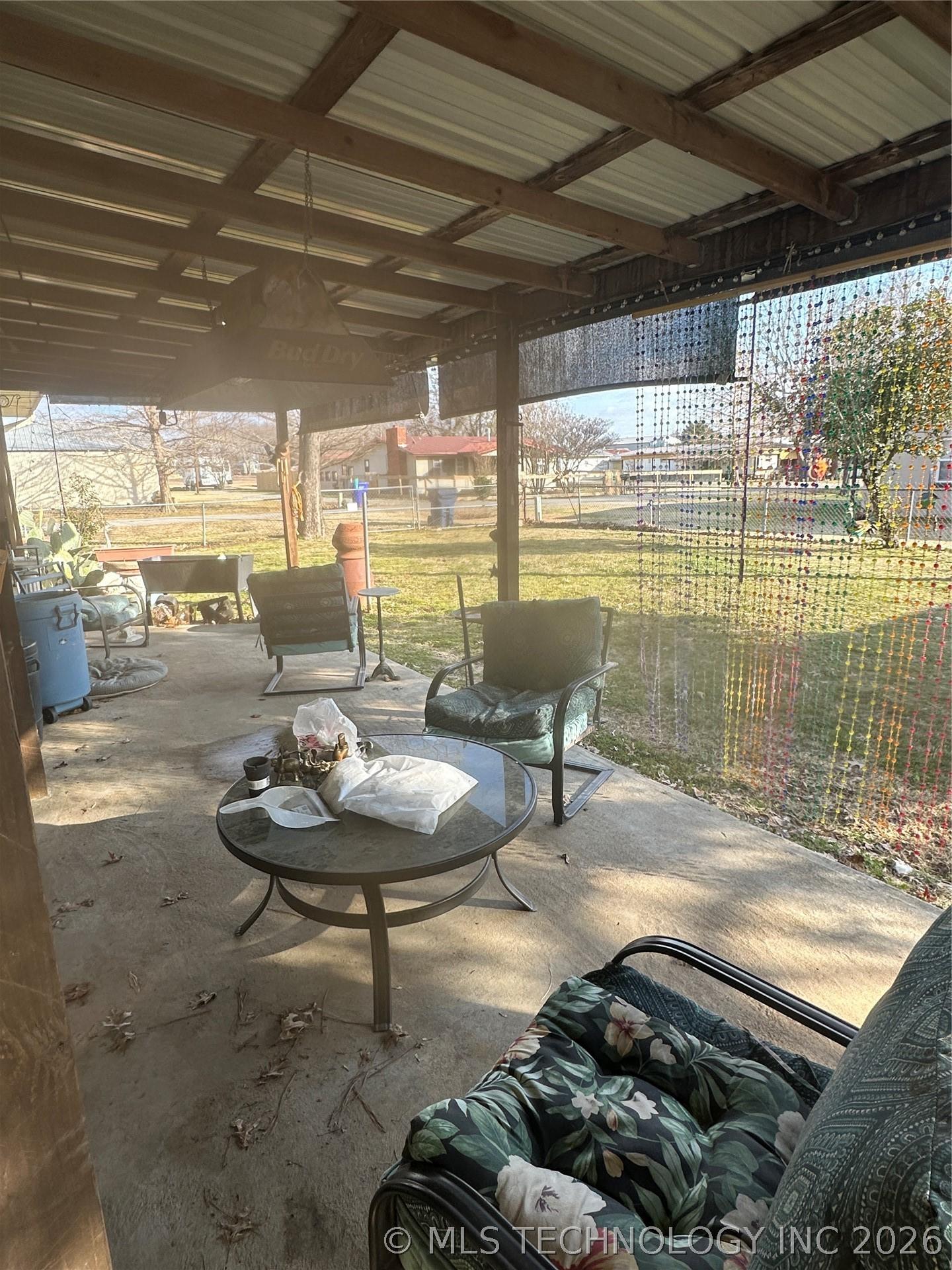 Image 4: LARGE COVERED PATIO IN THE BACK