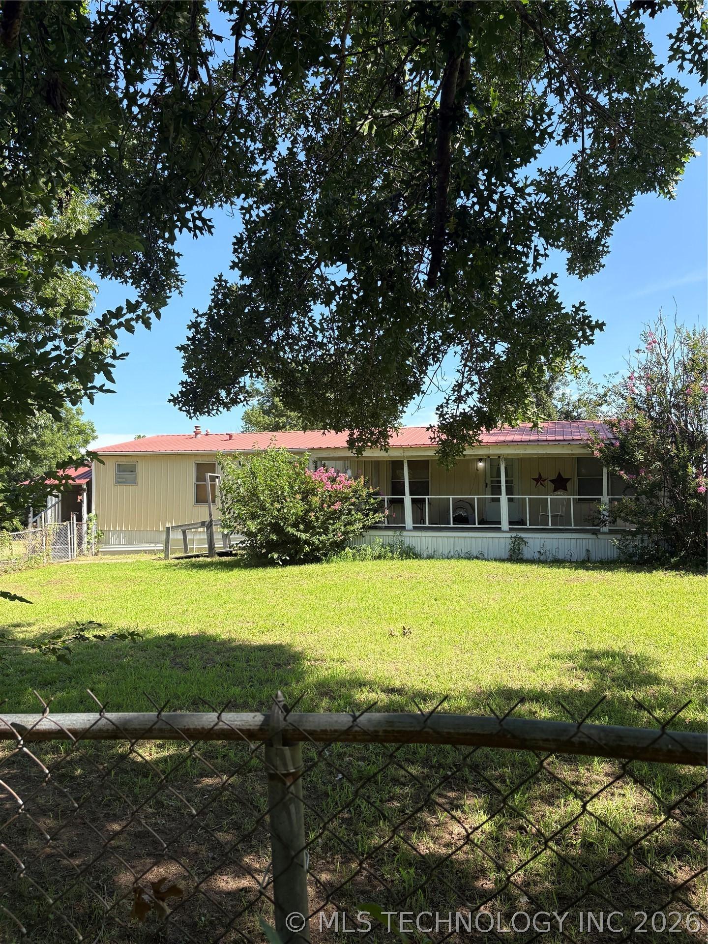 Image 2: House #1 - metal roof; large porch
