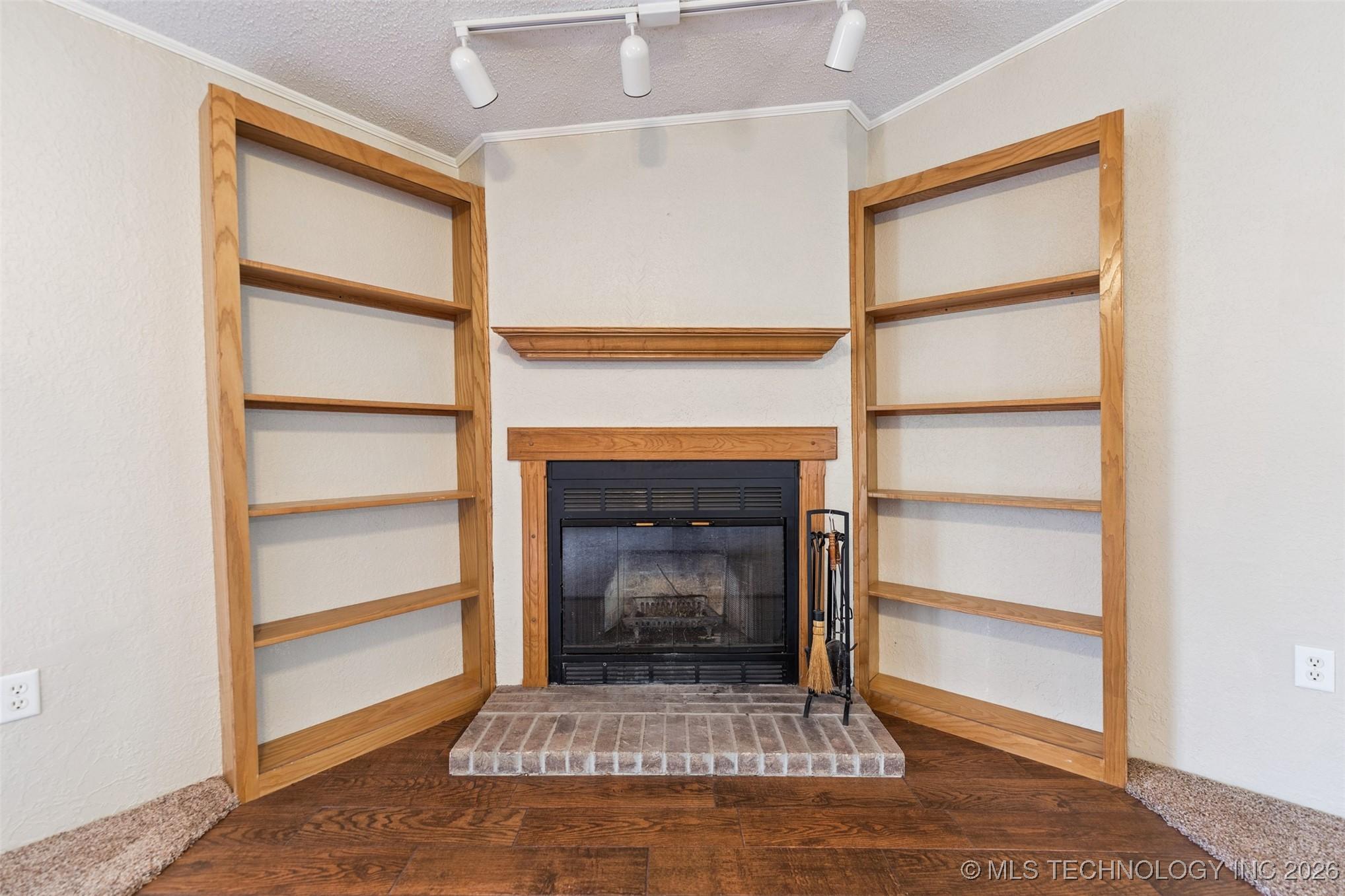 Image 4: Living Room Fireplace and Book Shelves