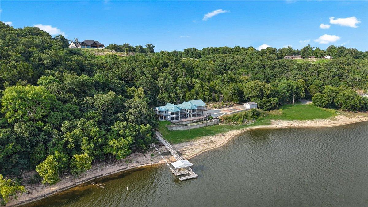Image 3: Waterfront property featuring a private dock with
