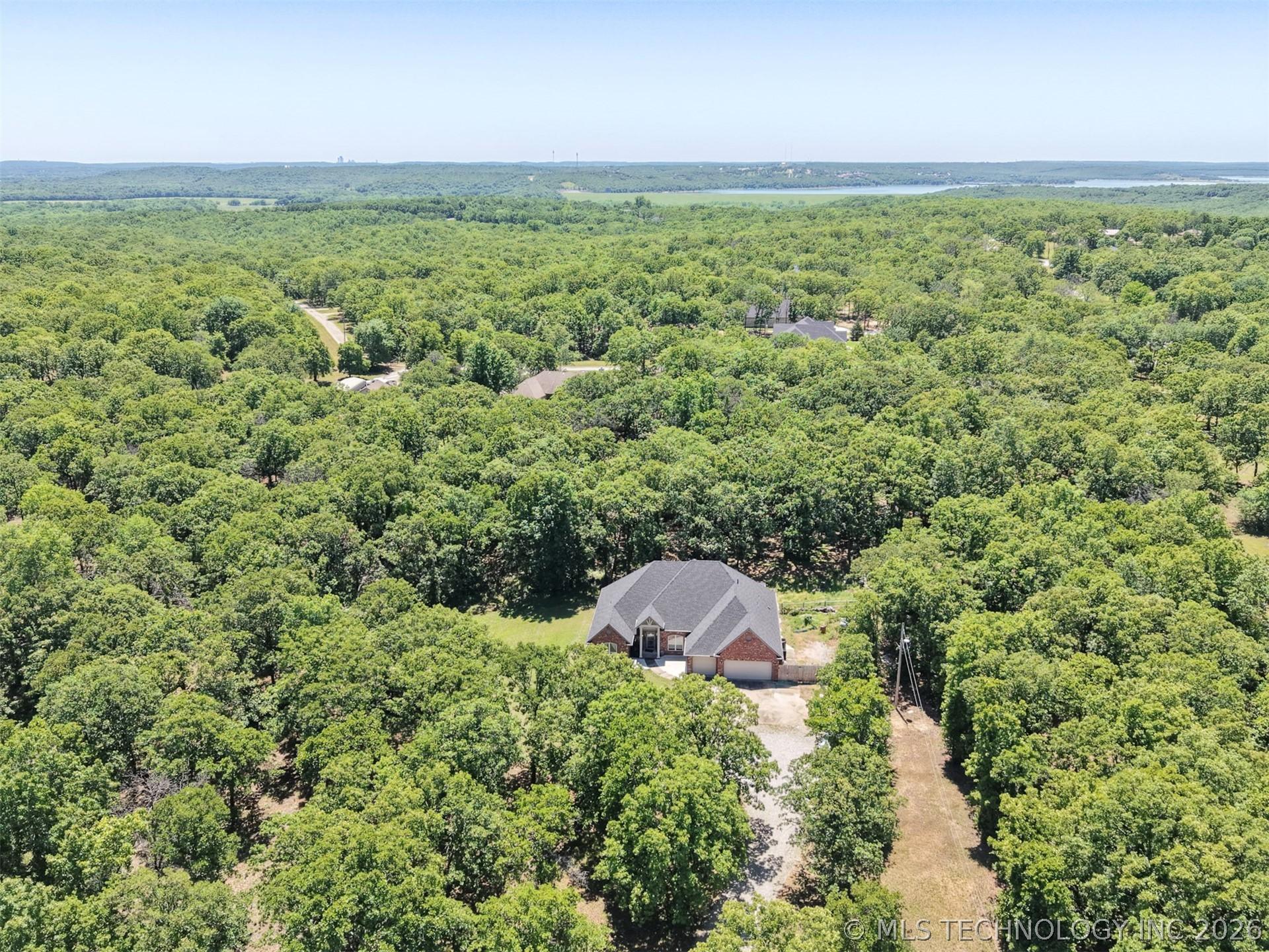 Image 2: Brick residence close to Skiatook Lake with a dark