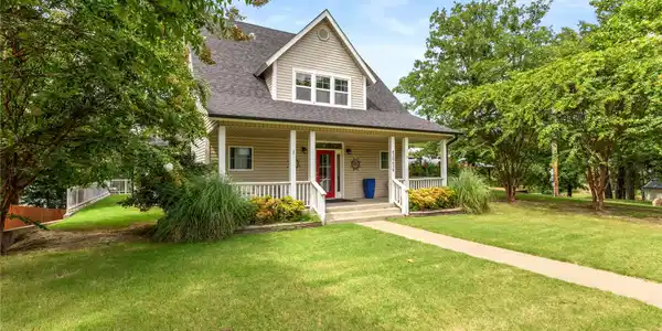 Image 3: Craftsman-style exterior featuring siding, a cover