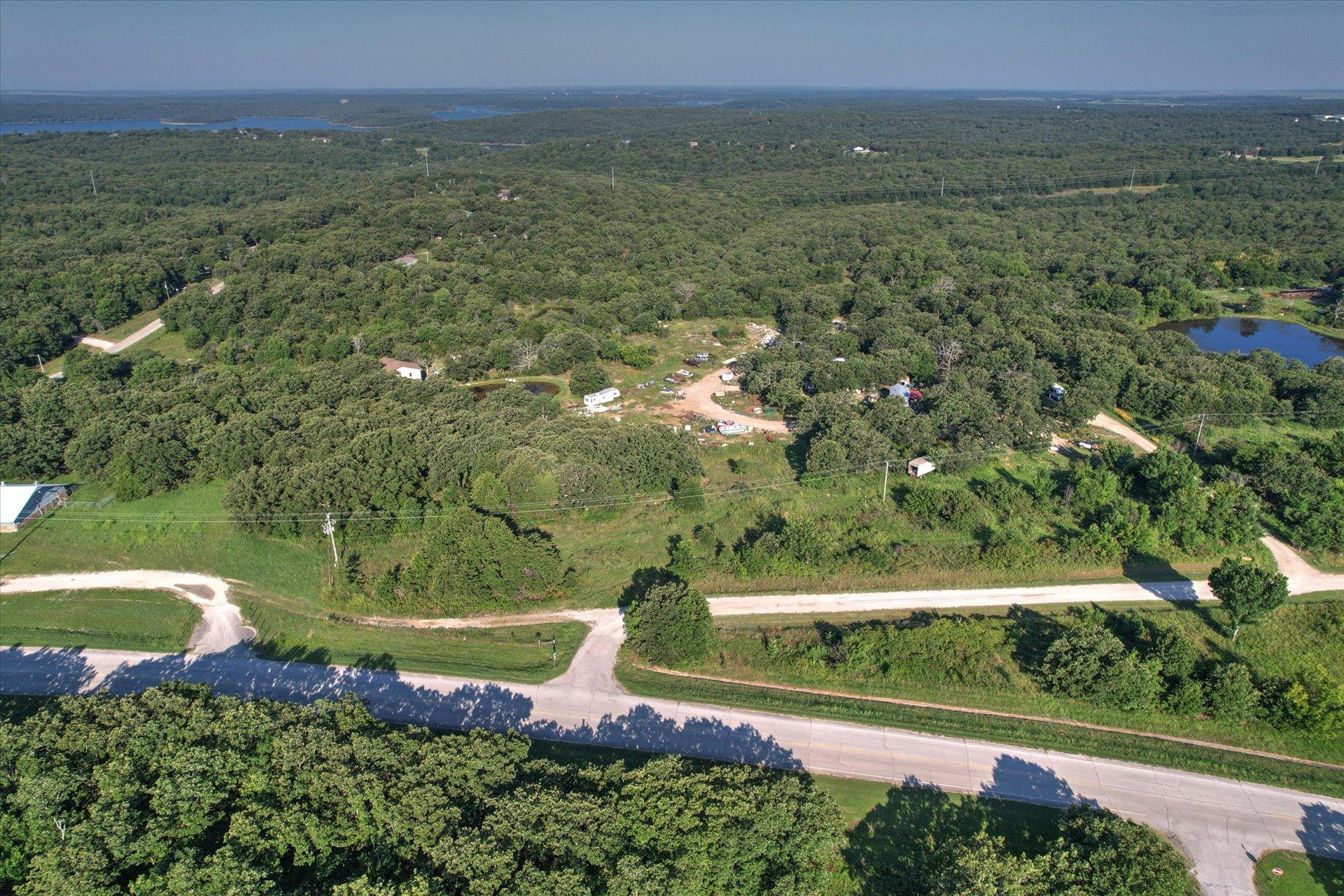 Image 3: Expansive wooded acreage featuring natural terrain