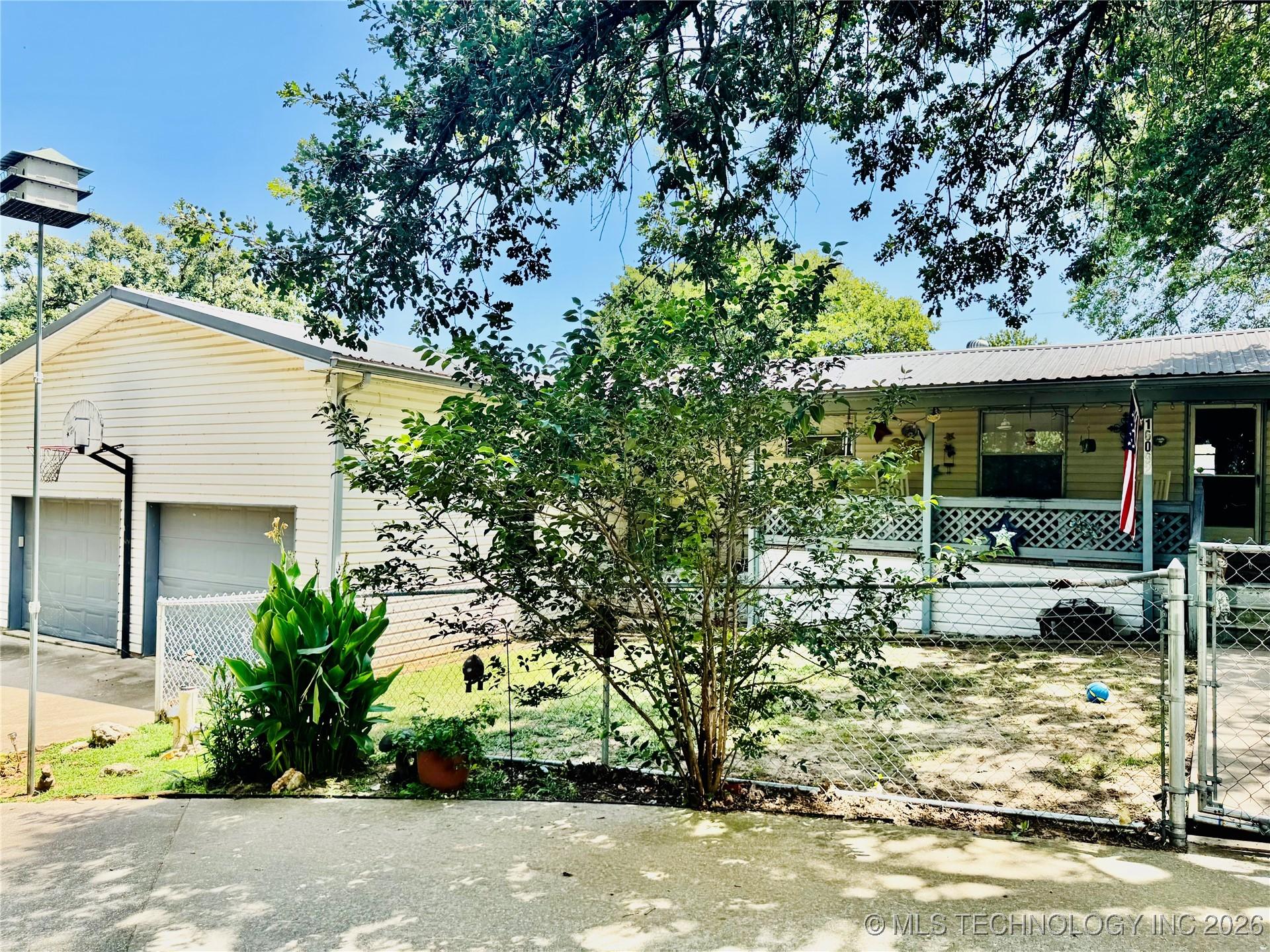 Image 1: Front yard & garage entrance
