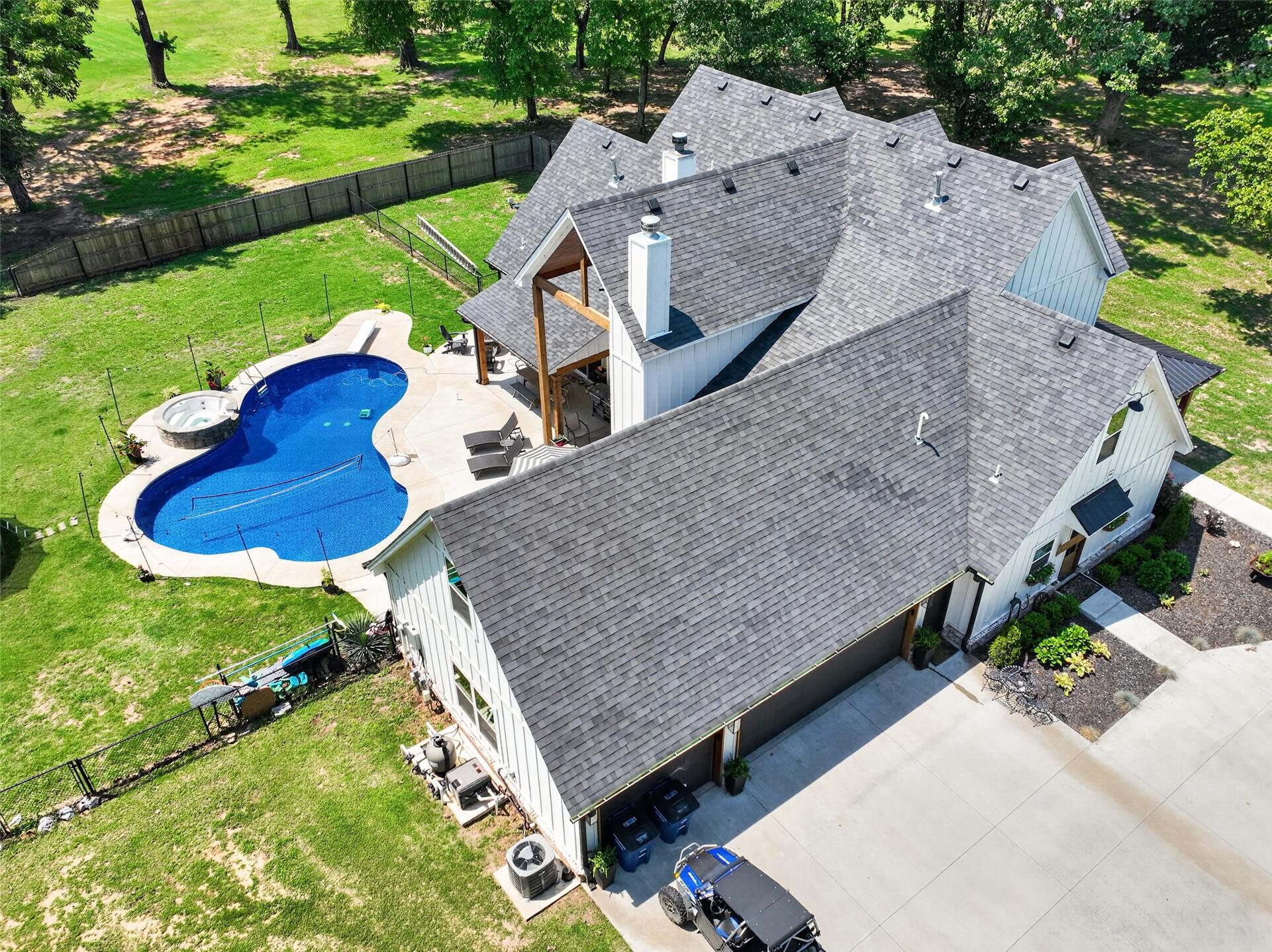 Image 4: Contemporary residence featuring a multi-gabled ro