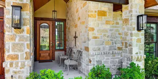 Image 4: Welcome Home! 
The blend of stone and wood create