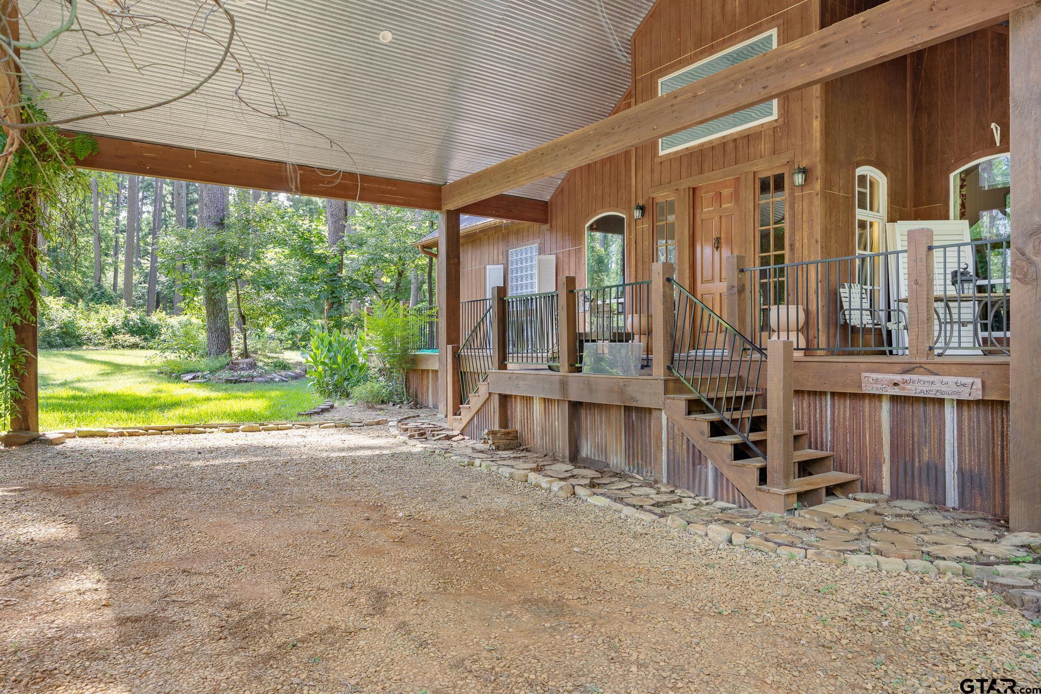 Image 2: Closer view of front entrance under porte cochere.
