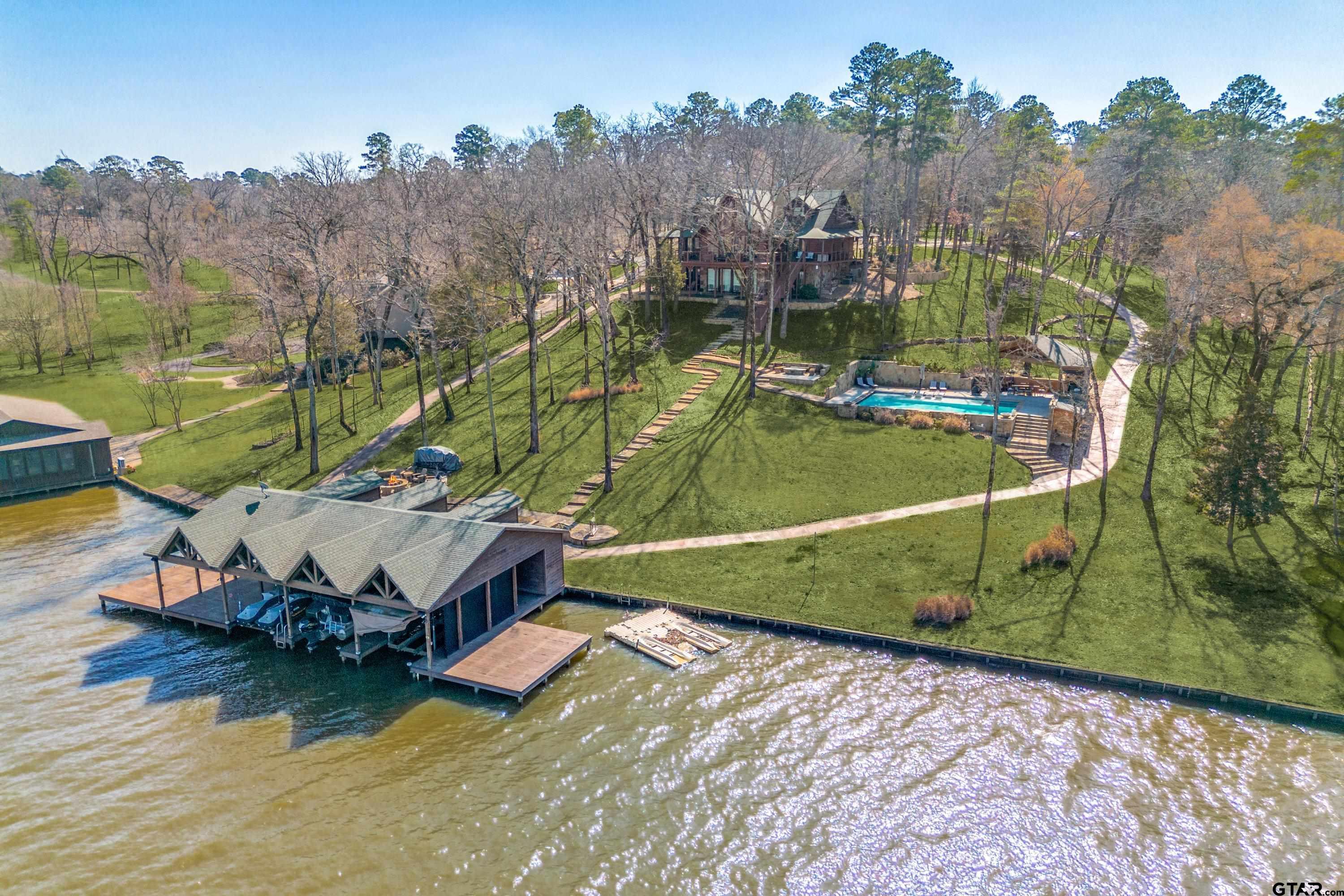 Image 1: Acreage aerial from the water